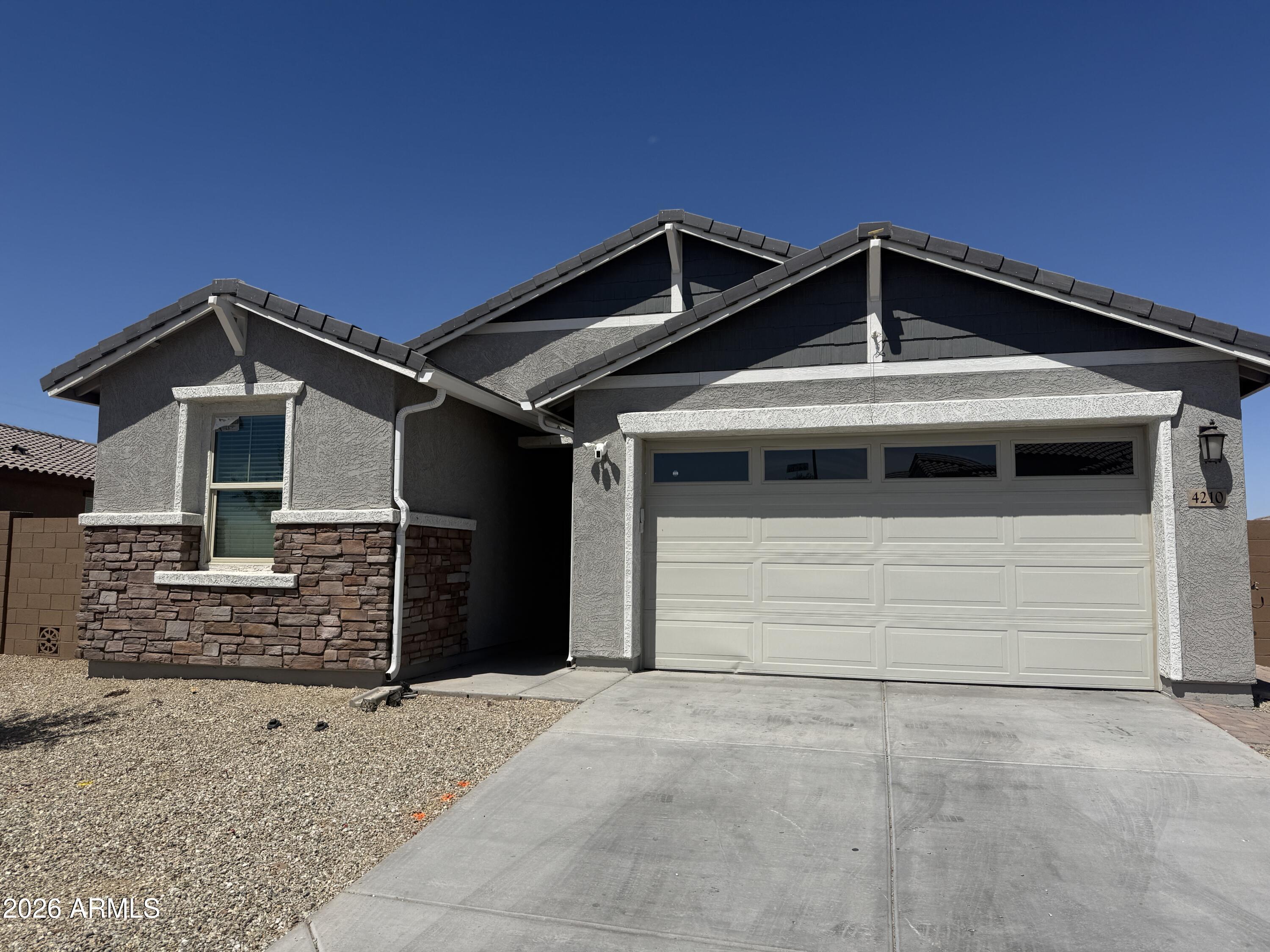 Welcome home to this spacious 5-bedroom, 3-bath residence in the desirable Sunset Farms community! Built in 2023, this thoughtfully designed floor plan offers flexible living space for families. Enjoy an open-concept kitchen and living area, generous bedrooms, and a private backyard. Conveniently located near schools, parks, shopping, dining, and easy freeway access. Priced at just $435,000--below comparable market values--this is an exceptional opportunity to own a newer home with instant equity potential. Don't miss out on one of the best values in Tolleson!