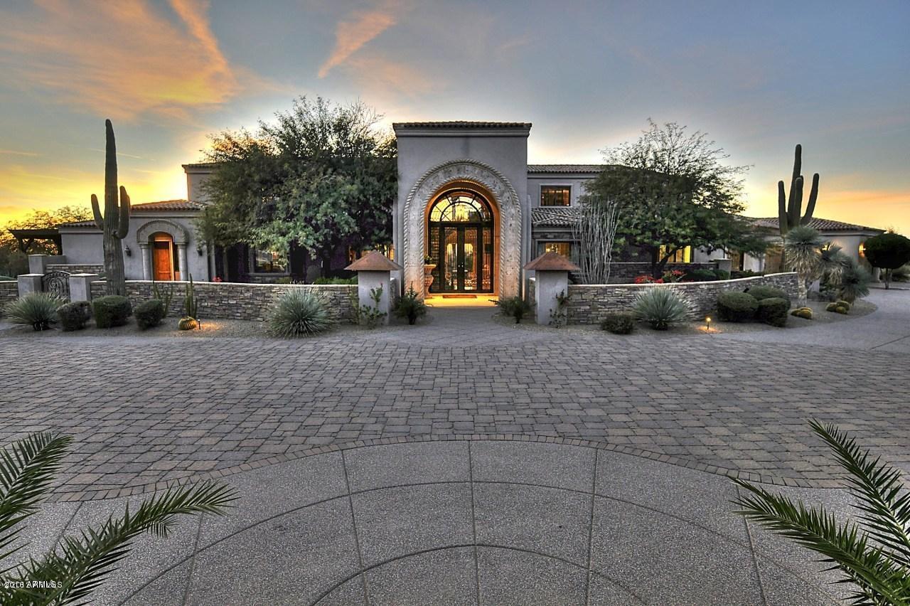 Extraordinary Estate with extraordinary views! This luxury property features over 10,000 square feet of opulent living and lifestyle benefits that cater to the most active of residents. Two attached guest houses, his/her offices, children's wing, home theater, game room, and outdoor amenities for entertaining! Over 4 acres of sprawling landscape surrounded by 180 degree views of sunsets and city lights!  Gourmet Chef's kitchen open to the very large family room, multiple exits to the expansive outdoor patios, decks, and balcony's.  If you are looking for a bargain in today's market this home is it! Truly a tremendous value!