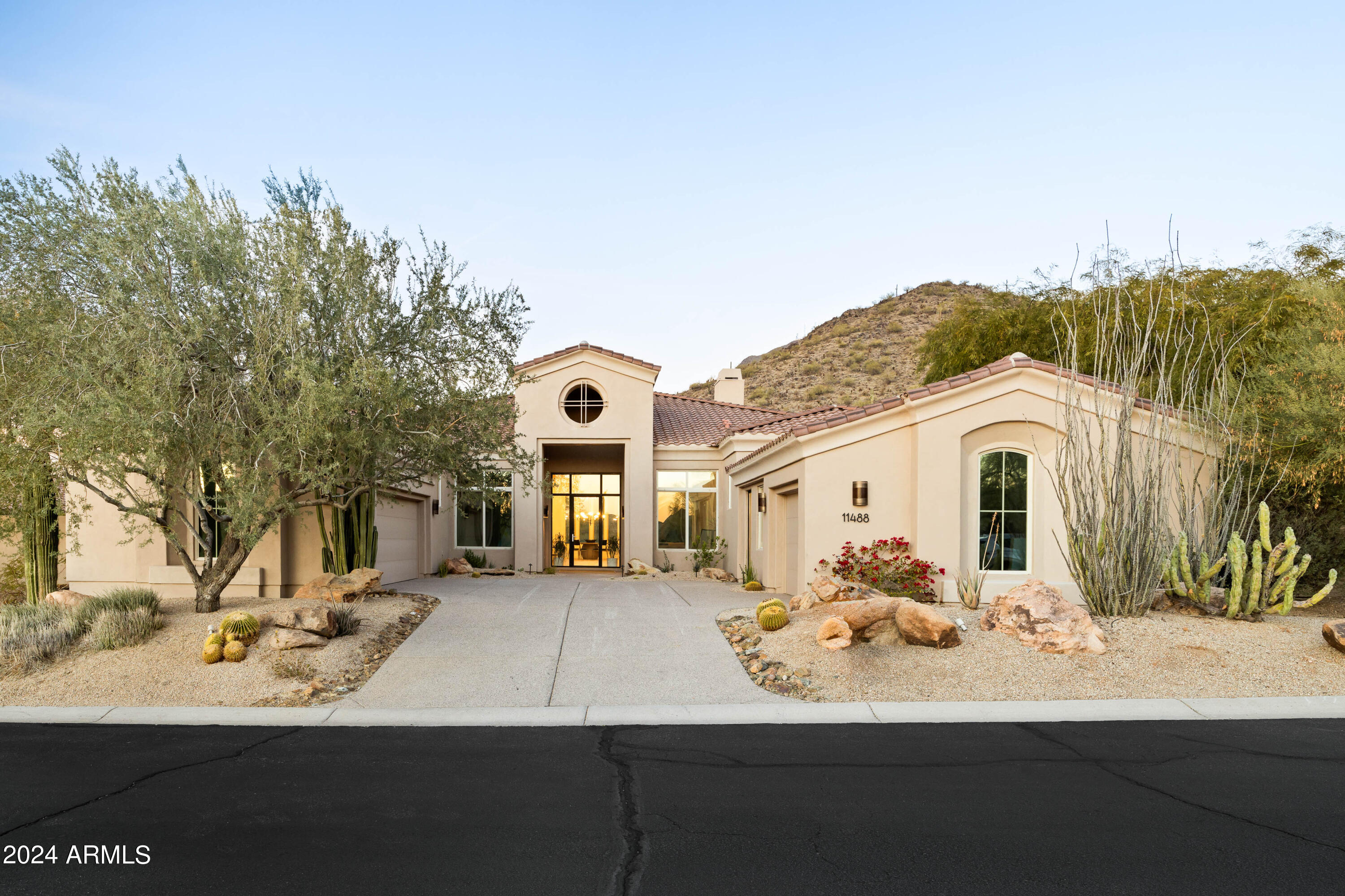 Nestled in the stunning McDowell Mountain Ranch, this contemporary residence combines breathtaking views of city lights and majestic mountains with an interior designed for both luxury and practicality. The split floorplan of the home separates the master suite from the secondary bedrooms, providing privacy and convenience. Adding to its versatility, the property features a casita that can serve as a guest suite, gym, or private retreat, complementing the main house's upscale design. With top-notch Thermador paneled appliances, custom cabinets, and European oak floors, this home encapsulates modern living in the desert, seamlessly blending form and function.