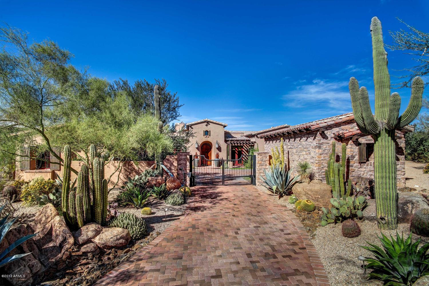 Truly Astonishing Spanish Hacienda style home built to perfection by Casas del Oso. Great Room with pocket doors opens the whole house up to the resort like backyard overlooking the 7th hole of the Mirabel Club golf course with amazing mountain and sunset views. Split floorplan with master and office on one side and two guest suites on the other. The 4th bedroom is an attached casita with seperate living quarters and bedroom. Back yard is as pretty as they come with multiple areas to sit and relax and enjoy the beautiful setting. True wine cellar underground with room for a tasting table. This home is being offered furnished with some exclusions.