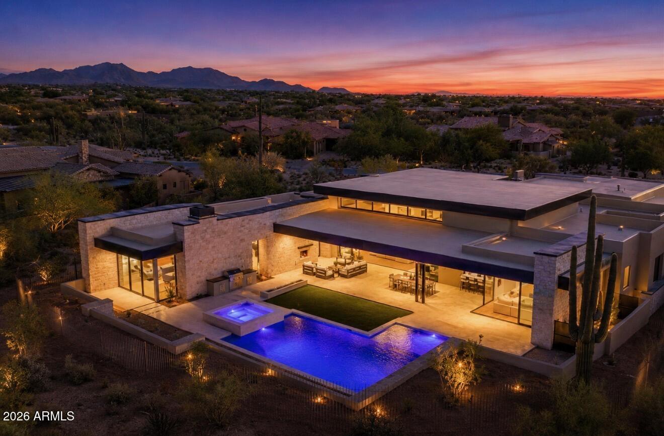 Steve Jensen Homes unveils another exceptional luxury residence located in the exclusive guard gated enclave of Whisper Rock Estates, one of Scottsdale's most coveted lifestyle communities.

Discover elevated living in this stunning 5,809 square foot estate, thoughtfully designed for both comfort and functionality. The home features 4 bedrooms and 5 bathrooms, a private office, game room, and a separated guest suite, offering flexibility for a variety of lifestyles. The primary suite is designed as a true retreat.  An oversized four car garage provides generous space for vehicles and storage. The heart of the home is a chef's kitchen designed for both everyday living and entertaining. Featuring Wolf and Sub Zero appliances, dual kitchen islands, a butler's pantry, wet bar, and two additional walk-in pantries, the space is as functional as it is striking. An expansive accordion style glass wall in the great room opens seamlessly to the outdoor living area, creating a true indoor outdoor experience and direct connection to the indoor/outdoor bar and entertaining spaces.
The outdoor setting is designed as a private retreat, complete with a fireplace, outdoor barbecue, fire pit, pool, and spa, creating an effortless backdrop for year-round Arizona living.

Whisper Rock stands apart for its unmatched privacy, elevated lifestyle, and a strong sense of community that truly defines the Scottsdale luxury experience. Residents enjoy scenic walking trails, a beautifully maintained park, a state of the art fitness center, community pool, pickleball courts, and an activities director who curates social events, fostering a welcoming and connected neighborhood.

Ideally positioned near the charming dining and shopping of Cave Creek and Carefree, with access to North Scottsdale conveniences, this home offers a balance of privacy and livability within a highly sought after guard gated community.
