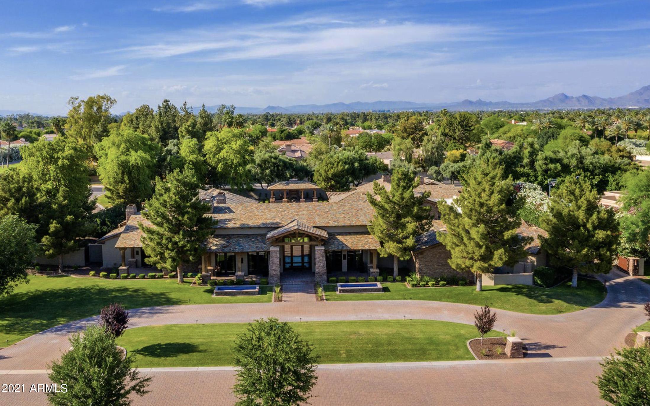 Welcome to Villaresi, a prestigious gated community accessed from Paradise Valley's most prestigious street. This home offers intimacy, privacy and security. A great value; quality construction, leaving no details untouched, this grand scale estate is flanked with custom finishes and a scrupulous eye to detail, perched on a 1.5 acres of mature landscaping. Interior features include an open floor plan, a decadent primary wing with an intimate sitting room, coffee bar, dual closets, and a dedicated gym, sauna and steam shower. A generous chef's kitchen with top-of-the-line appliance package, abundant storage, butler's pantry a total of 5 guest suites, and 2 offices, makes this a destination estate for today's work from home lifestyle.  SEE MOTION VIDEO A bonus guest house is fully contained with kitchen, living room and en-suite bedroom. The unique U-shape design offers breathtaking views of the resort-like backyard to enjoy year round with multiple covered patios, pool, spa. 5 Car Garage, climate controlled storage, custom theater, wine cellar, and game room with wet bar - this home has it all.