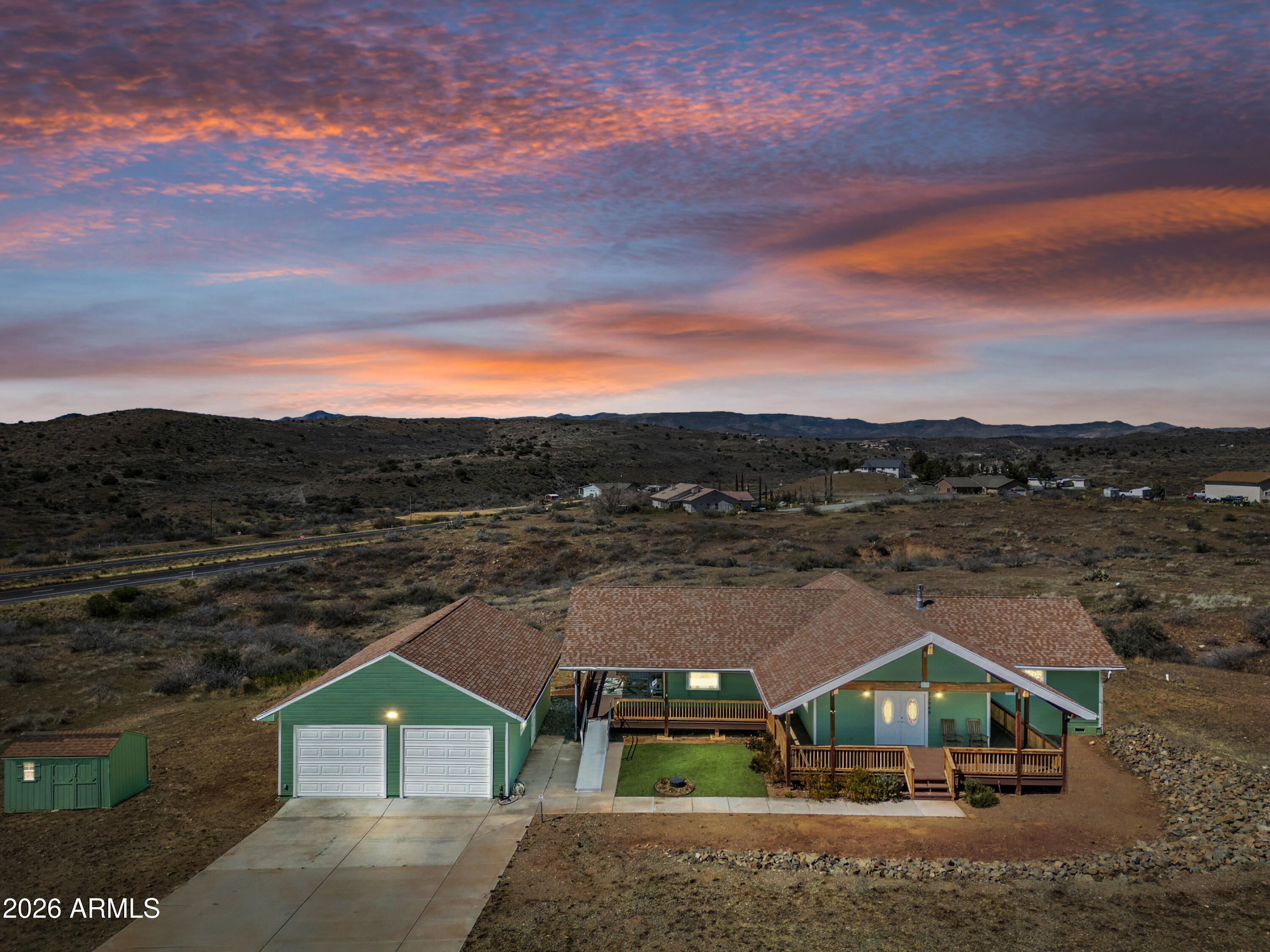 If you're looking for star filled night skies, cooler summer temps, mountain views in all directions and space, look no further! This beautiful 3 bedroom, 2 full bath home features a large great room  and open concept kitchen. The great room features a massive vaulted ceiling with wood, tongue and groove planks, a cozy gas fireplace, in floor electric outlets and dining space. A large eat-in kitchen island, gas stovetop and convection oven create a wonderful experience for the home chef. The large primary suite offers a large bedroom, large walk in closet and a large primary bathroom. In the primary bathroom, you will find a separate shower with built in bench, a large jetted soaking tub and dual sink vanity.  The property consists of a large 940 sq ft garage, a garden shed and... partial wrap around deck made of low maintenance composite decking. There is parking and a clean out for an RV next to the home. All this and close to BLM land, hiking trails, Prescott, the Verde Valley, Sedona and only an hour from Phoenix or Flagstaff! Seller is a licensed Real Estate Agent in the state of Arizona.