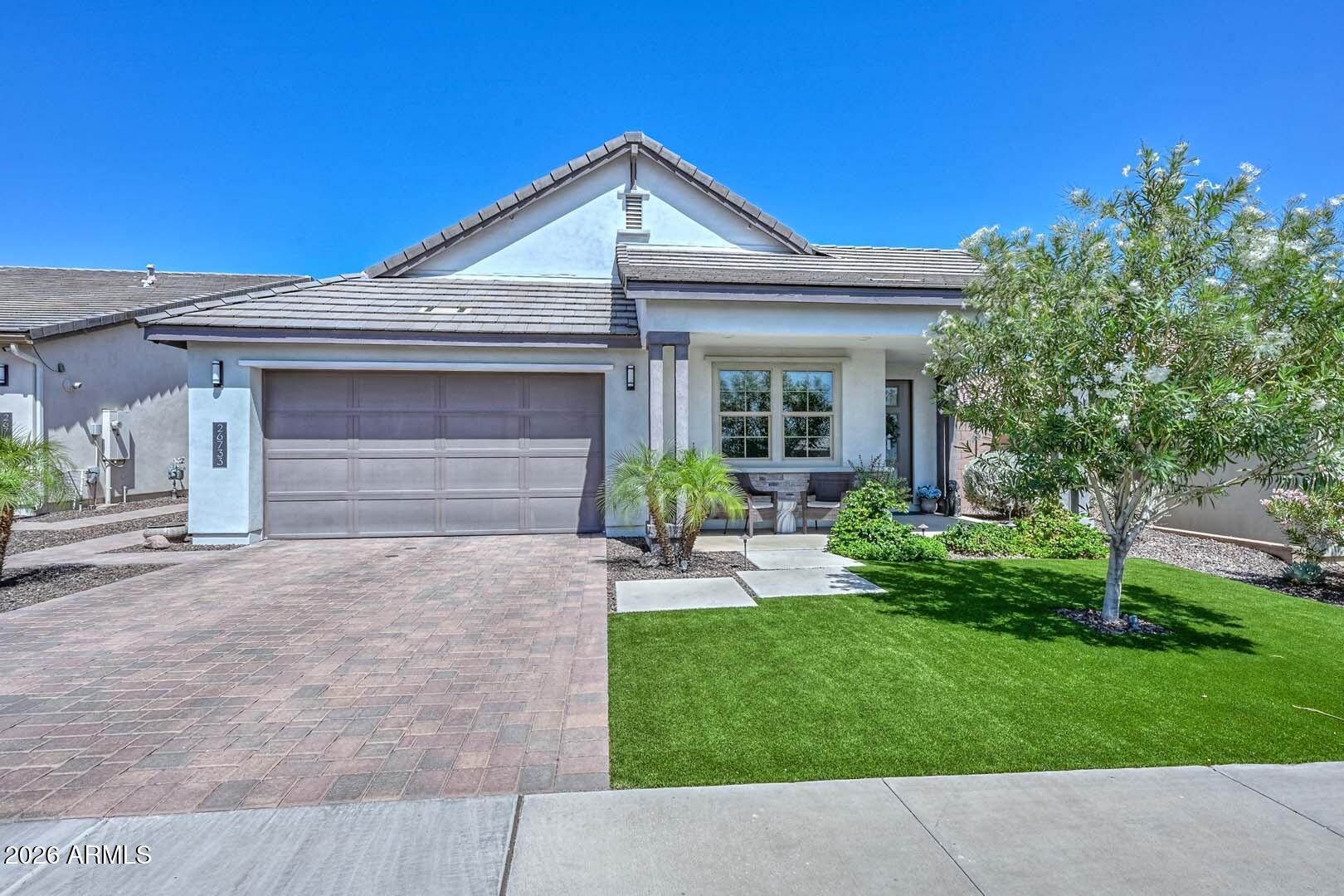 Beautifully upgraded ''better than new'' Shea Homes home in sought-after Aloravita featuring a desirable split-bedroom floor plan with 4 bedrooms and 3 bathrooms. This light, bright home showcases stunning mountain views, extensive upgrades, and thoughtful designer finishes throughout.

The gourmet kitchen is the heart of the home with an oversized extended island, extended cabinetry, elegant granite countertops, subway tile backsplash, pendant lighting, and abundant recessed lighting. Tile flooring flows through all living areas, while upgraded carpet adds comfort in the bedrooms.

Enjoy indoor-outdoor Arizona living with covered front and back patios, ceiling fans, artificial turf in both front and back yards, and low-maintenance landscaping. The open-concept layout offers a spacious feel with plenty of natural light throughout