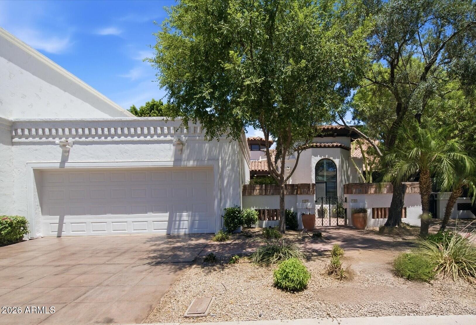 Experience elevated Scottsdale living in this completely remodeled townhome located in the highly sought-after Cuernavaca community. A charming private courtyard welcomes you home and provides the perfect setting to enjoy your morning coffee or evening glass of wine.

Inside, soaring vaulted ceilings, skylights, and natural light create an open and inviting atmosphere. The spacious living and dining areas center around a beautifully redesigned fireplace, now enhanced with custom tile, and integrated media accommodations, creating a stunning focal point for entertaining.

The fully reimagined kitchen showcases custom SOLLiD cabinetry, premium Whitendale Cambria Quartz countertops, designer lighting, matte black fixtures, and upgraded KitchenAid appliances, blending luxury and functional Wide-plank white oak engineered hardwood flooring flows throughout the home, complemented by fresh interior and exterior paint, designer-selected hardware, upgraded doors, and contemporary lighting throughout.
The luxurious primary suite offers a private retreat with a sitting area, walk-in closet, and a spa-inspired ensuite bathroom featuring dual vanities, quartz countertops, LED mirrors, custom tile work, and a beautifully finished walk-in shower. The secondary bathroom has also been completely renovated with new cabinetry, fixtures, tile surrounds, and modern finishes.
Additional highlights include a dedicated laundry room with utility sink, ample storage throughout, and a garage featuring built-in cabinetry, air conditioning, and epoxy flake floor coating.
Step outside to the serene backyard, thoughtfully redesigned with new landscaping, 12X24 Sabia limestone hardscape, updated irrigation, accent lighting, a covered patio, and multiple sitting areas--perfect for relaxing or entertaining guests year-round.
Ideally located just minutes from Scottsdale's premier dining, shopping, golf, entertainment, and convenient freeway access, this truly turnkey residence offers the rare opportunity to enjoy a completely renovated home where every detail has been thoughtfully curated.