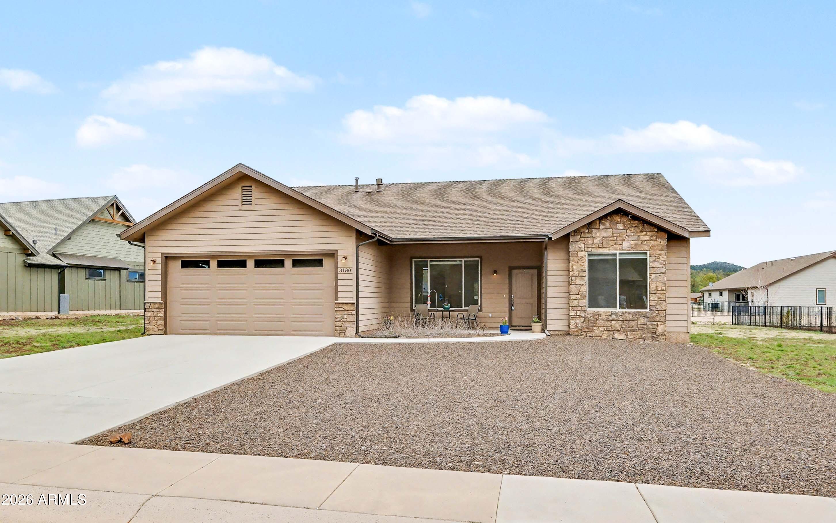 Tucked away in a quiet cul-de-sac in Highland Meadows and surrounded by the peaceful setting of Elephant Rocks Golf Course, this home offers a lifestyle defined by privacy, open space, and a slower pace. Large picture windows fill the interior with natural light, while the great room's vaulted ceilings and gas fireplace create a warm, inviting place to gather. The open kitchen is thoughtfully designed with upgraded cabinetry, stainless steel appliances, and granite countertops. The split single-level floorplan and 10-foot ceilings in the bedrooms enhance your sense of space. Enjoy a covered patio and mountain views from the backyard. Low maintenance native landscaping blends seamlessly into the natural environment and saves on water. A flat, south-facing driveway is great for all seasons!