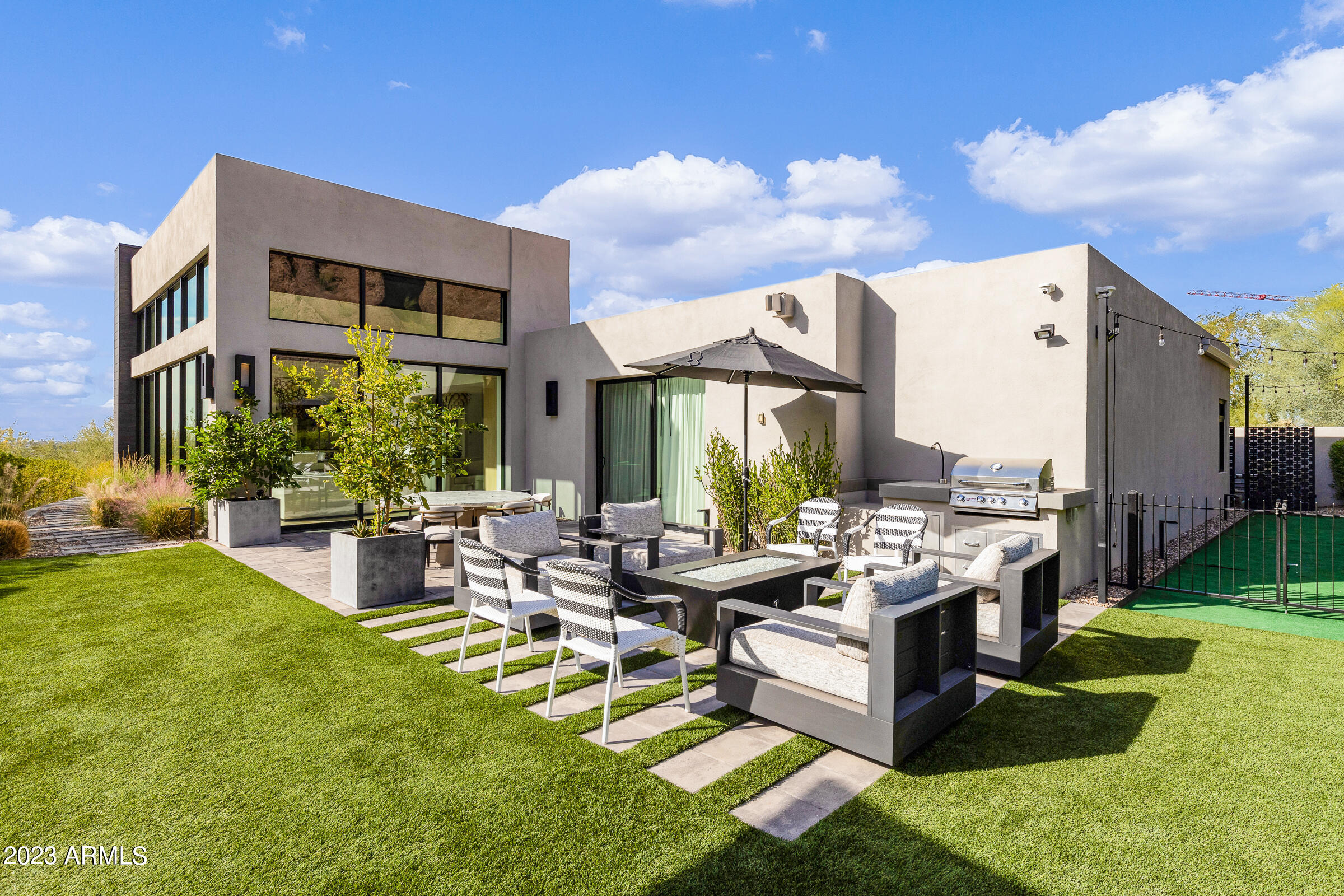 Exceptional residence provides pure tranquility surrounded by exceptional views of Camelback Mountain. Located in a quiet cul-de-sac directly underneath The Praying Monk. Enjoy the privacy you've been looking for. This home is packed with wall-to-wall elegance, sophistication and most importantly comfort. Immaculate craftsman details run through this bright and open home including hardwood floors, stone surfaces in the kitchen and baths with designer lighting. Entertain your guests w/ an outdoor kitchen, spa and Fire pit.