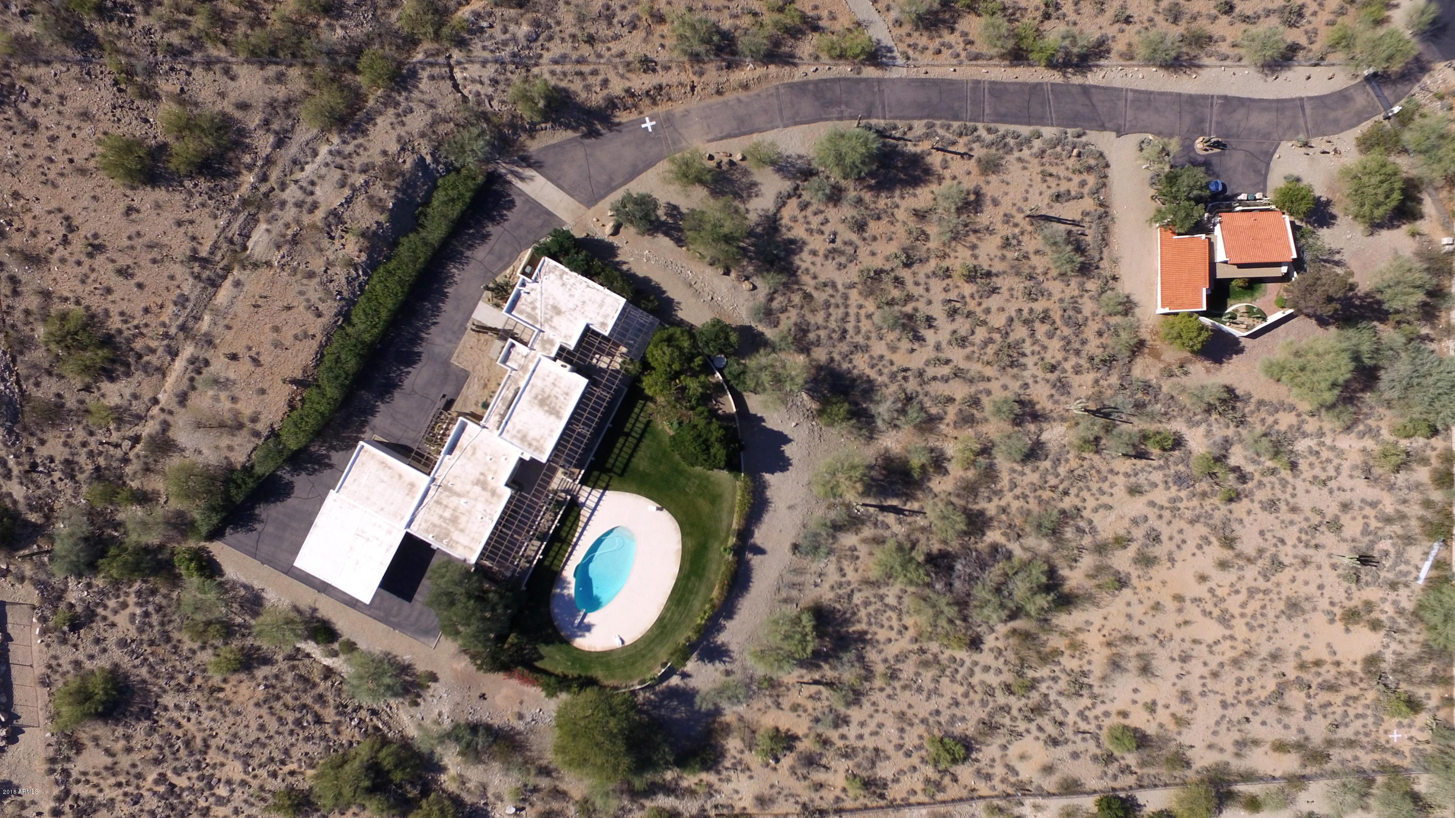 Builder’s opportunity at Mummy Mt. Estates in Paradise Valley. Choose either 5 or 10 acres for your next custom construction project ($3.5 to $7 mil). Enjoy Panoramic views of the Valley from both lots that sit nestled in Mummy Mountain. Comfortably surrounded by architectural masterpieces, the skyline and cascading mountain ranges provide extraordinary privacy and tranquility. Recently surveyed and topographic study performed by a licensed engineer, indicates an ideal buildable space/ divisible into two five-acre lots. Absolutely Incredible valley-wide view lot (#15) or gently sloping lot (#16) with pre-existing home and guest quarters ready for your architect to sketch-up your dream estate. First time on the market, this exclusive location is priced to sell and won’t last.