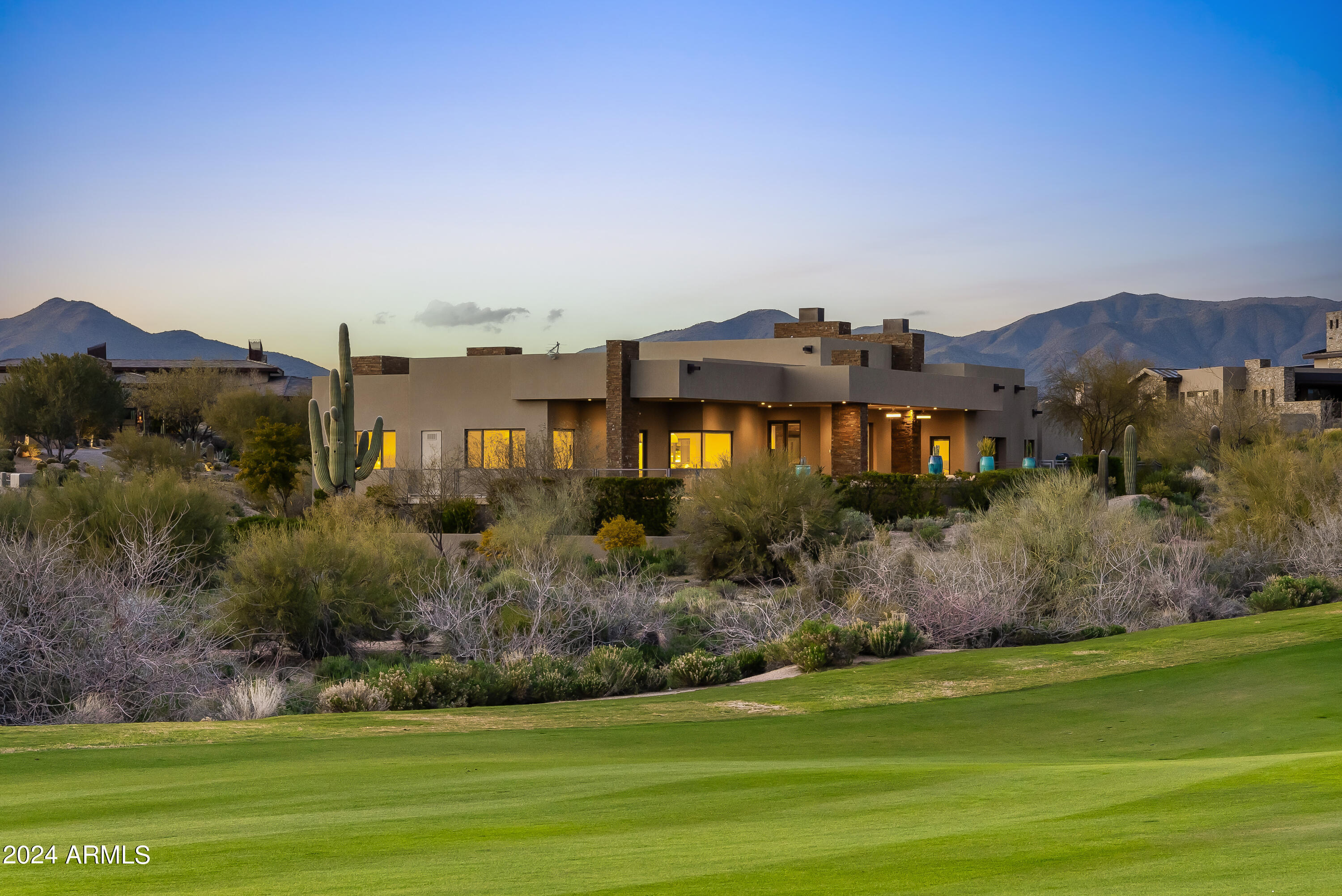 GOLF MEMBERSHIP AVAILABLE per the Bylaws. Newer, soft contemporary home. Expansive 1.16 acre fairway lot. Breathtaking views from the tee to the green of the 13th hole. A long, elevated bridge brings you to the artfully done, copper coated garage doors. Grand foyer, Open floor plan. Suspended ceilings, expansive family room w dramatic stone fireplace. Spectacular chef's kitchen. Dual islands, dual dishwashers & double ovens, sleek cabinetry, six burner gas range. Wine refrig., bar seating & cozy breakfast nook. Master suite/bath offers a pure serenity spa-like experience w fireplace, washer/dryer hook up, opulent walk in shower w multiple shower sprays. Sliding pocket glass doors boast large covered patio, sleek zero edge heated pool, spa spillover. Private lot. TRUE RESORT-STYLE LIVING!