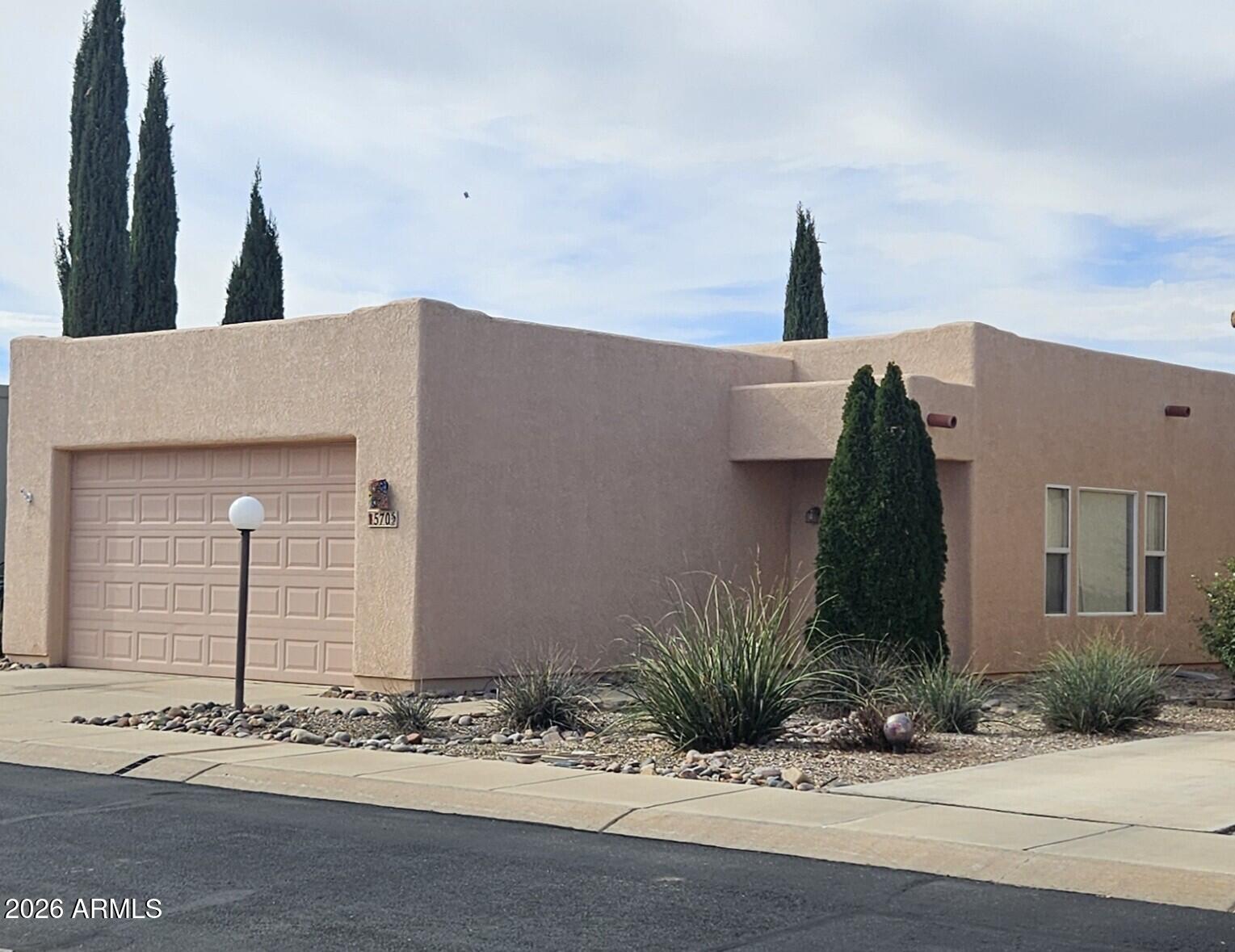 55+ Community. 2 bedroom, 2 bath. 1,404 square feet. Feels larger than it is due to an open living area concept. Both dining room and primary bedroom have access to the covered patio. Walk in closets in both bedrooms. Large primary bath with water closet. Corner lot. Gated community with many amenities such as, Club House, Theater room, Library, RV Resort, Fitness center and Pickleball.