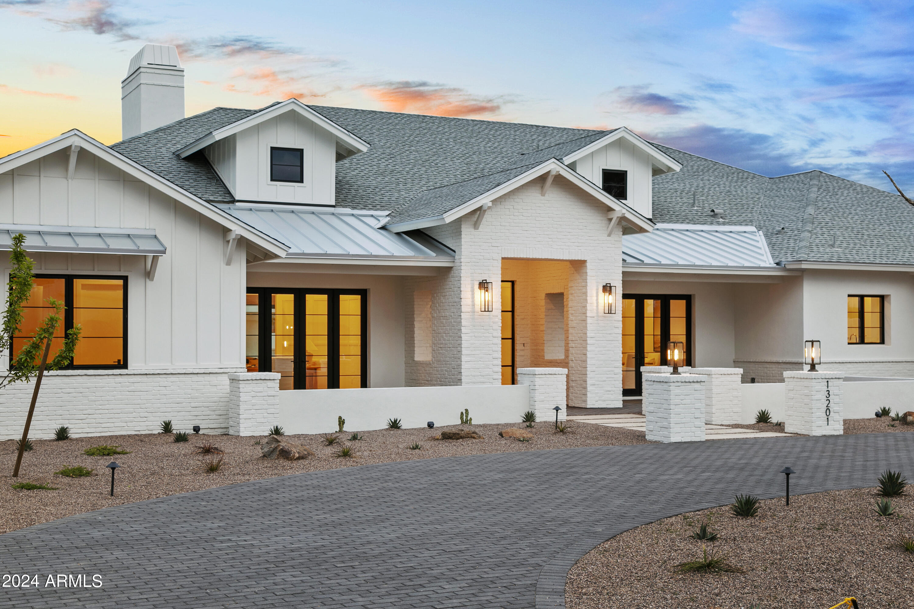 Welcome home to this incredible new modern farmhouse in a prime Scottsdale location with mountain views. The latest collaboration between E & S Builders and THELIFESTYLEDCO is a perfectly designed 5,728 SF main house with four car garage and 1,025 SF guest house on a sprawling 35,000 SF lot. All finishes, fixtures, features and technology have been carefully selected and installed for the most discerning buyers. The split floor plan features a luxurious master suite, three ensuite bedrooms, office, teen room, dining room, butler's pantry, massive great room and an absolutely stunning kitchen. Enjoy the beautiful backyard with spectacular pool/spa, endless patio space, outdoor kitchen area, firepit, low maintenance turf and a perfect area to add a sports court or customize.