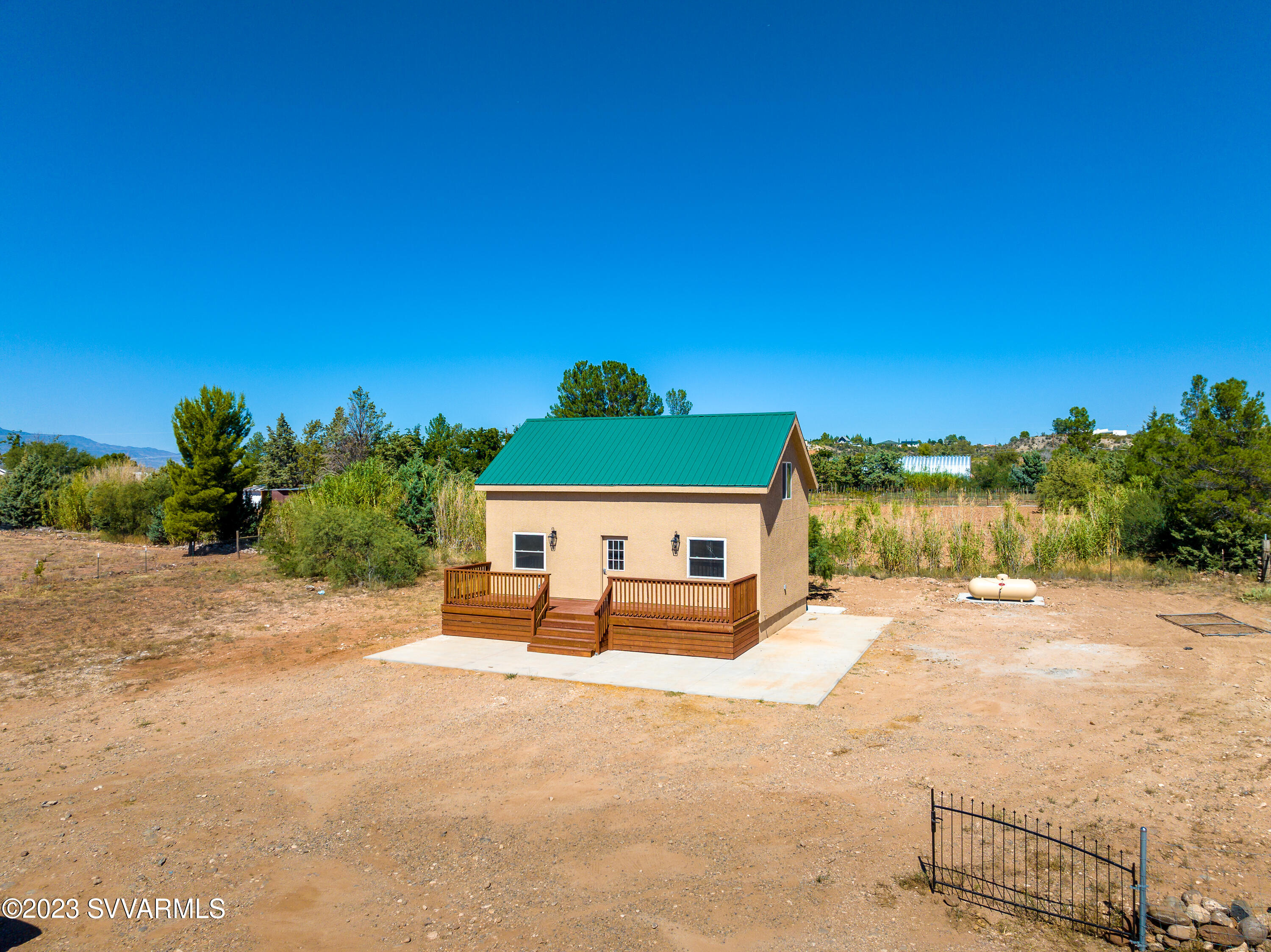 Cottage for Sale, new build

OFF GRID, 2bd, 2 ba, 2 story house, approx 1000 sf,  on 1.5 acre lot.   Located in Camp Verde Arizona in rural community, 
Solar powered, well, septic tank, propane tank, fenced yard, 30 irrigated pecan trees on fence line, close to arena.
included are stove, refrigerator, dishwasher, water softener, air conditioning, heaters, and space for stackable washer and dryer.  There is a lot of storage space within the house. Plenty of room on parcel for large main house.