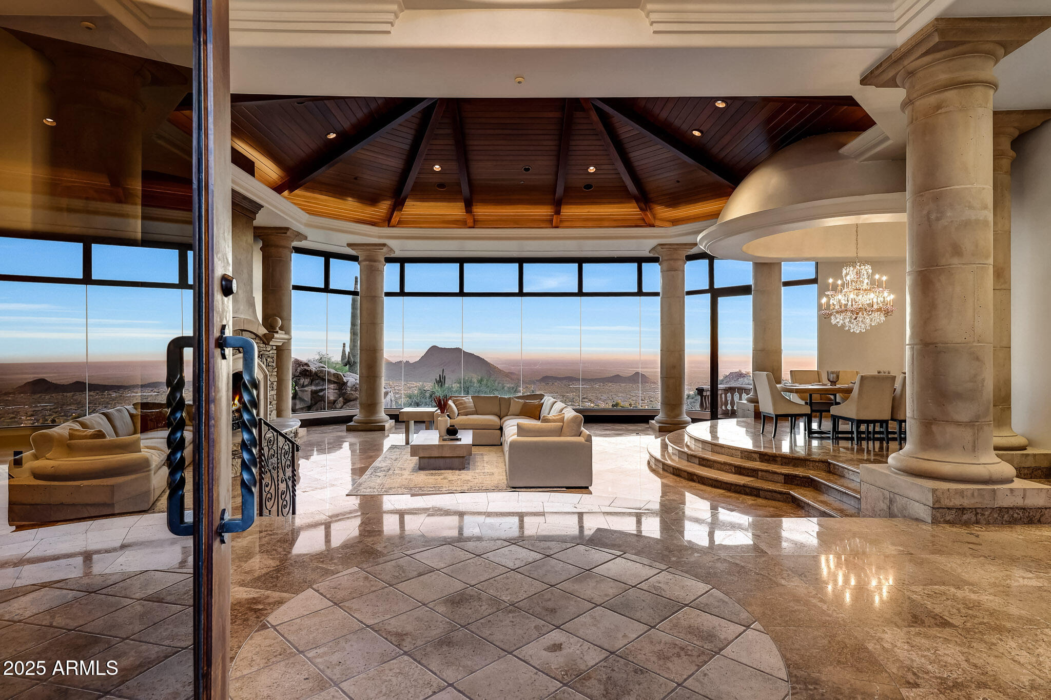 Experience unbeatable MOUNTAIN, CITY LIGHT, and SUNSET VIEWS perched high above the valley in the prestigious, double-gated Silverwing enclave of Scottsdale Mountain. This hillside estate offers 5BD w/ CASITA & 4.5BA with likely the BEST VIEW in Scottsdale. PLUS, the home sits on one of the community's highest lots, backing to protected NAOS for PERMANENT PRIVACY, making it special and unlike anything you have seen before. Every aspect of the home reflects thoughtful planning and uncompromising quality. Expansive walls of glass frame the scenery from nearly every room, while multiple patios seamlessly connect indoor and outdoor living. Each bedroom enjoys direct access to outdoor spaces, ensuring the dramatic views are always front and center. The primary suite features a Canterra stone fireplace, comfortable sitting area, private balcony, and a spa-like bath with dual vanities, generous custom closet storage, and a soaking tub positioned to overlook the canyon below. The resort-style backyard is highlighted by a heated negative-edge pool with grotto waterfall and spa, complemented by a built-in BBQ and fireplace ideal for entertaining or unwinding under Arizona's star-filled skies. The protected desert landscape below guarantees lasting seclusion, with no neighboring homes in sight. The outdoor areas also feature inviting courtyards, shaded patios, and a backyard designed to maximize comfort while capturing the surrounding vistas. The private casita is ideal for guests or multigenerational living and is thoughtfully appointed with an ensuite bathroom, wet bar, spacious walk-in closet, dedicated washer and dryer hookup, and separate entrance. One oversized secondary bedroom offers flexibility as a media room, office, or bonus space and includes a convenient wet bar. This is a rare opportunity to own a meticulously crafted and cared for estate where privacy, views, and timeless design come together in one unforgettable setting. With recent updates including brand new water heaters, updated pool pumps, exterior paint, AC units, resealed flat roof, and re-pebbled heated spa, it's ready for you to move right in! Don't forget the HOA amenities of pickleball/tennis courts, guard gate, and secondary gate. What more could you need?