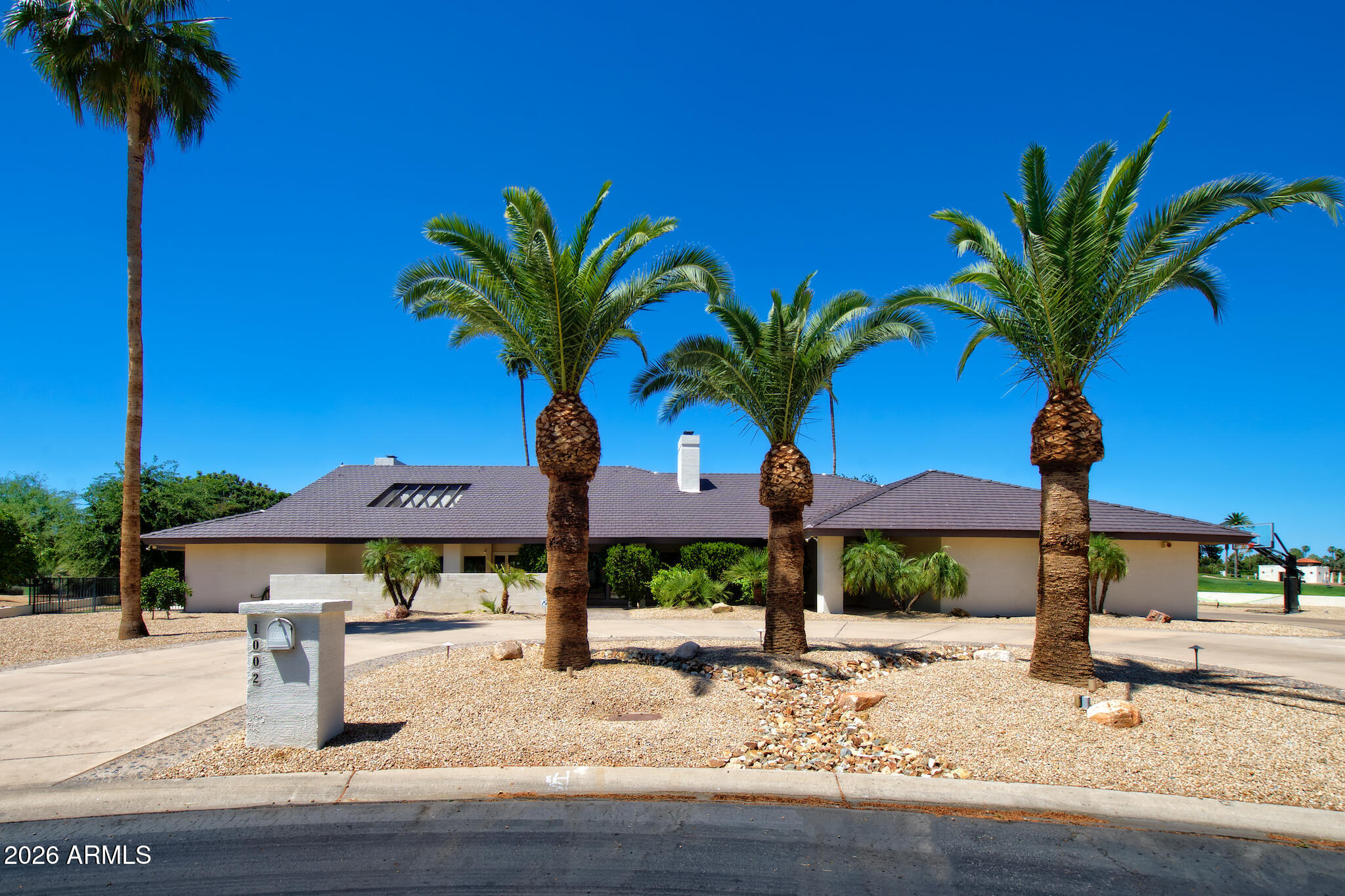 The Crown Jewel of Litchfield Park:
Discover the pinnacle of golf course living on this premier oversized cul-de-sac lot. This 4,000+ sq. ft. custom estate offers unrivaled 180-degree views of the historic Wigwam, featuring a front-row seat to the iconic 15th hole island green on the Blue Course. The experience begins in a grand atrium, leading to expansive living spaces with refinished hardwoods and a stone fireplace. The gourmet kitchen is a chef's dream with a Sub-Zero fridge and double ovens. Outside, luxury meets leisure with a sparkling swimming pool and an expansive covered patio with remote-controlled shades. With all its historic charm, this resort-style oasis offers a prestigious lifestyle in an unmatched Arizona setting!