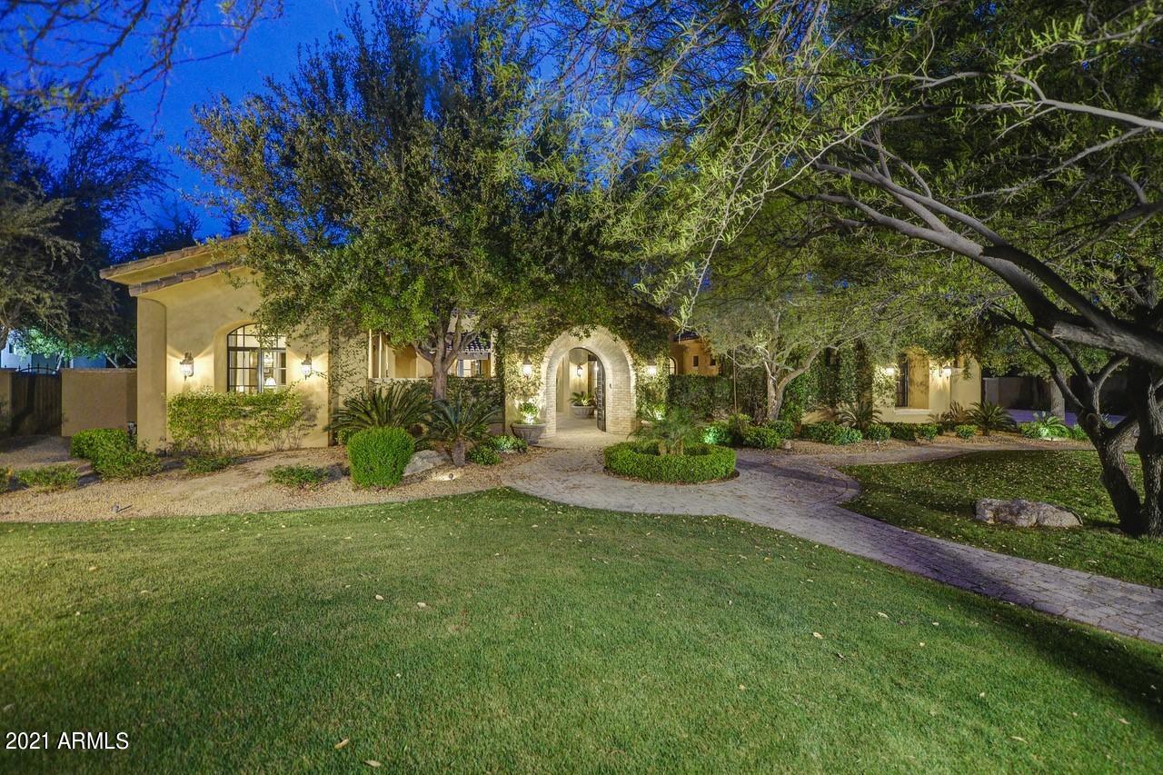 Exquisite custom estate perfectly positioned on a spectacular, premium lot in a beautiful Scottsdale neighborhood. This elegant Tucson style home is an entertainer's dream with a split floor plan, 700 bottle temperature-controlled wine room, butler's pantry & 5 gas log fireplaces with Cantera stone surrounds. The gourmet kitchen features a 60 inch Wolf Range, Subzero refrigerator & 3 dishwashers. There is a full casita, 4 en- suite bedrooms, a bonus room, media room & dedicated office. The spacious master bed/bath suite is the perfect retreat with a walk in closet, claw tub, separate shower and dual vanities. The backyard sanctuary is paradise found with lush green grass & a resort style pool lined with palm trees. There are 5 high efficiency AC's providing 7 climate zones & low E windows. The construction of this home was executed with 8" engineered post tension concrete masonry block on the exterior. This Integra System is filled with polyurethane and then a 2 x 6 interior furring is applied with fiberglass insulation. The doors are made of high quality solid wood knotty alder and there are reclaimed oak floors with the utmost detail. This home was built with the utmost care and attention, providing the highest quality and durability.
