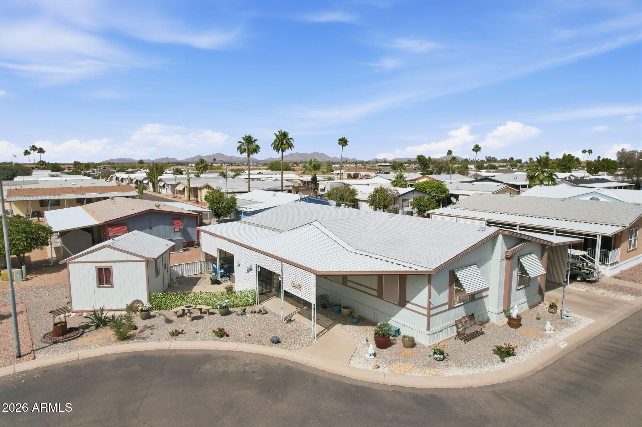 Live the resort lifestyle in Sunwest Resort Village, a sought-after 55+ active adult gated community in Casa Grande! Located on a desirable cul-de-sac lot, this beautifully updated home offers 2 bedrooms, 2 baths, plus a large den/home office. Enjoy the Arizona room, air-conditioned workshop, covered carport, and inviting covered porch. Recent updates include a newer stove and dishwasher (2024/2025) plus two new skylights for added natural light. Sold partially furnished. Community amenities include a pool, spa, fitness center, clubhouse, billiards, shuffleboard, BBQ area, planned activities, and dog walking areas, Resort-style living close to shopping, dining, and golf. Perfect for full-time or seasonal living!