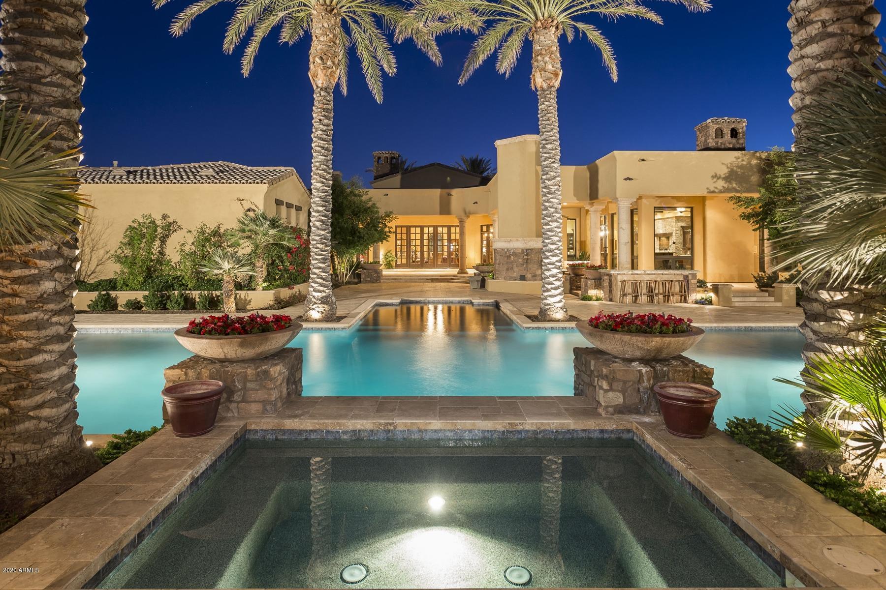 This traditional home offers all the elegance, romance and Old World Charm that is fitting this bespoke Luxury Home. Completely custom, no detail has been spared in design of finishes. Lasting quality abounds with stone, marble and granite detailing, luxury carpets, decorator lighting. The location is superb: The corner gated lot offers privacy and charm, complete with patios, verandas and three outdoor fire features, fountains, pool and yard that simply defines the term ''Resort-Like''.  Compare this to ANY luxury home and you'll be impressed at the value and features. Offered for a fraction of other area traditional homes, you'll enjoy all the locations and luxury... with NO HOA!