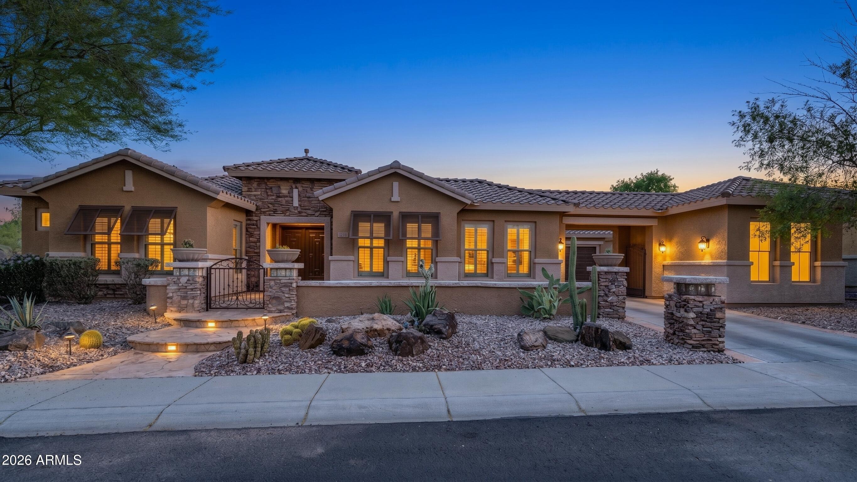 Rare and highly sought after Admire model, complete with a porte-cochere leading to a massive front courtyard and FOUR garage spaces. From the moment you arrive you will admire the beautiful stone work, lush landscape & iron accents.  Walk through a beautiful double door entrance into a home that has been beautifully upgraded & lovingly cared for.  Wood shutters,  ceramic tile, custom storage, designer lighting, fireplaces for cozy evenings & custom barn doors. This gorgeous home boasts a gourmet kitchen with stainless appliances, a large island, ample storage, a built in desk & a stunning  decorative backsplash.  The backyard is truly an entertainers delight...swim, play, and enjoy all the beauty that Arizona has to offer.   Nestled in the heart of Anthem, this home is not to be missed. The award winning community of Anthem offers something for everyone!  Adventure Playground, water park, all wheel skate park, Daisy Mountain Railroad, Anthem Veteran Memorial, dog park, walking trails, pickleball courts, basketball, workout facility, catch and release fishing and so so much more!  Enjoy carnivals, Music In May, parades and yummy local eateries.  Close to shopping, entertainment, hiking and freeway access.   Sonoran living at its finest!