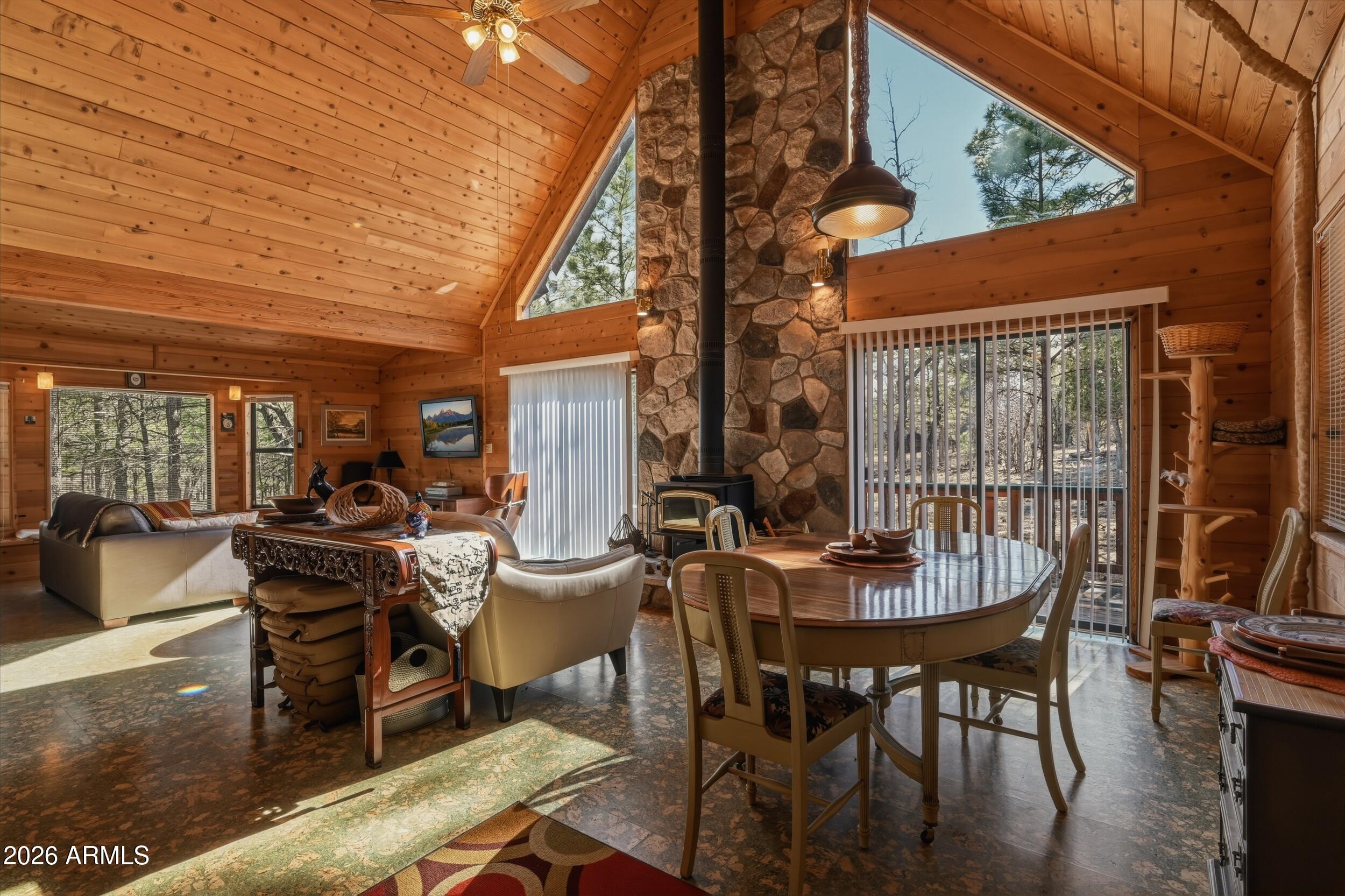 PRIVATE SANCTUARY just for you..This cozy chalet style cabin offers 2 bedrooms and 2 bathrooms and open living area.  Downstairs offers your main living area as well as a guest bedroom and bath. New unique cork flooring in great room brings the outdoors inside.  Great double doors opening to the large deck area letting you enjoy the wildlife inside or out. Lot is just over an acre and a pie shape giving you a lot of privacy behind the home for outdoor living. As you go upstairs to the master bedroom loft suite it offers plenty of room for your bed as well as a sitting area or office, also opens up to a private balcony to have your morning coffee. T& G walls and ceilings bring warmth and comfort throughout paired with the stone fireplace/woodstove offering total relaxation.  This is a great great second home, primary home or weekend getaway.  Bring your horses too.