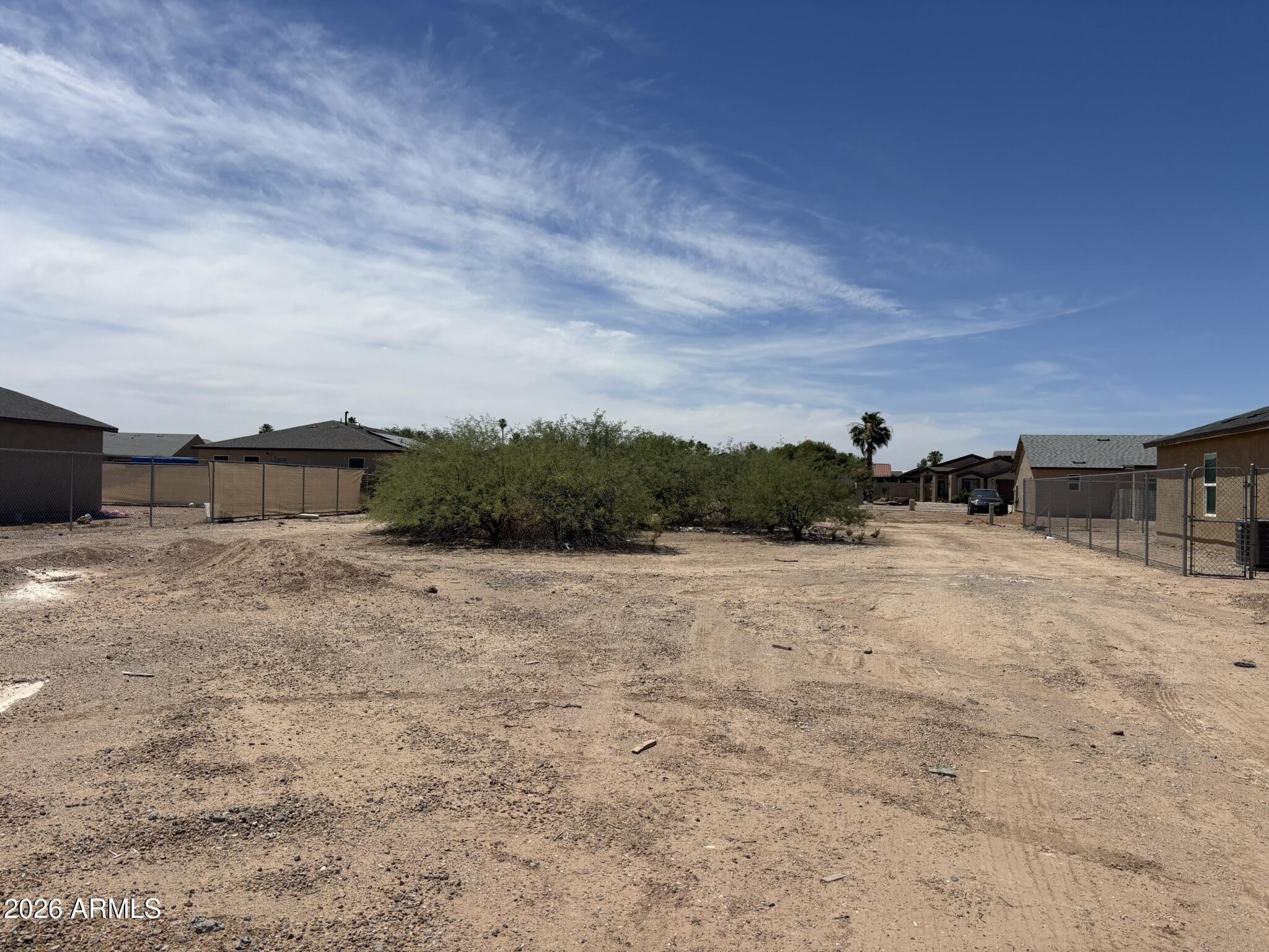 Very nice LOT to build your dream home in Arizona. This is an established neighborhood. This lot is just steps away from the LAKE.  This lot has North/South exposure.  Location is close to to I-10 & I-9 Corridor.  Buyer to verify utilities, building permits, measurements, schools,