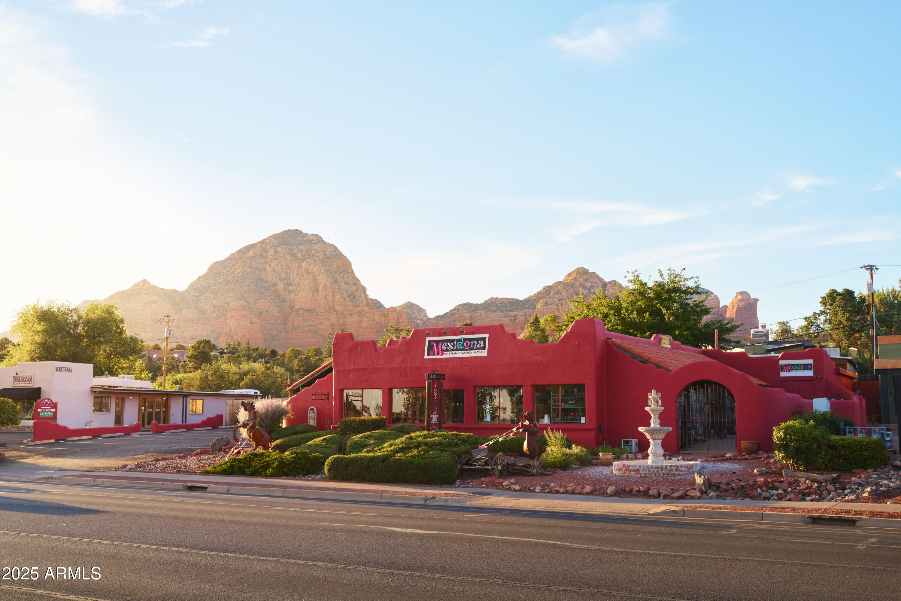 Prime Mixed-Use Opportunity in the Heart of West Sedona. Situated on nearly half an acre with over 144 feet of frontage along bustling W State Route 89A, this rare mixed-use property offers endless potential in one of Sedona's most high-traffic corridors—over 26,000 vehicles per day! The site features an existing mix of commercial retail space and areas for other uses, totaling over 8,500 square feet across multiple structures. Currently used as a highly successful furniture and retail store. Offering unmatched visibility in both directions with minimal setback from the roadway, the property includes easy access, abundant parking, and a high-traffic location fueled by Sedona's thriving tourism industry—generating more than $1 billion in annual economic impact. (MORE) Property Highlights:
"	Lot Size: ±0.48 acres (20,909 SF)
"	Zoning: Commercial
"	Parking: 25+ spaces across ±4,000 SF paved lot
"	Property and buildings well maintained and cared for
"	Occupancy: Delivered vacant at COE (retail)
"	Parcel Numbers: 408-25-018 & 408-25-019; This listing include both parcels
Buildings Include:
"	Retail Space: 4,716 SF
"	Enclosed Porch: 1,053 SF
"	Storage Areas: 900 SF enclosed + 533 SF storage + 311 SF mezzanine
"	Apartments: 550 SF (Unit 1) and 442 SF (Unit 2)
Premium Location + Flexible Use Options
Located in the commercial core of West Sedona and in the proximity of Sedona's luxury home communities, this site is currently used for a retail furniture and accessories store. This property provides a prime location suited for a variety of businesses, including tour companies, wine tasting venues, restaurants, speakeasies, medical practices, retail showrooms, and more. Inside, you'll find five adaptable rooms ideal for showrooms, lounges, dining spaces, cooking classes, private events, or other hospitality uses. Additional features include outdoor patios, dedicated shipping and storage areas, and convenient restrooms, enhancing both versatility and functionality.
Allowable Uses Include: Retail Store, Bar/lounge, microbrewery, salon/spa, retail, winery, distillery, medical/dental office, tour company, daycare, church, government or admin offices, school (public/trade), assisted living, garden nursery, equipment sales, and more. Buyer to verify uses.
A Rare Sedona Investment with Massive Upside.
Whether you're looking to launch a flagship business, expand your brand, or invest in one of Sedona's most desirable commercial corridors, this property offers flexibility, visibility, and location all in one.