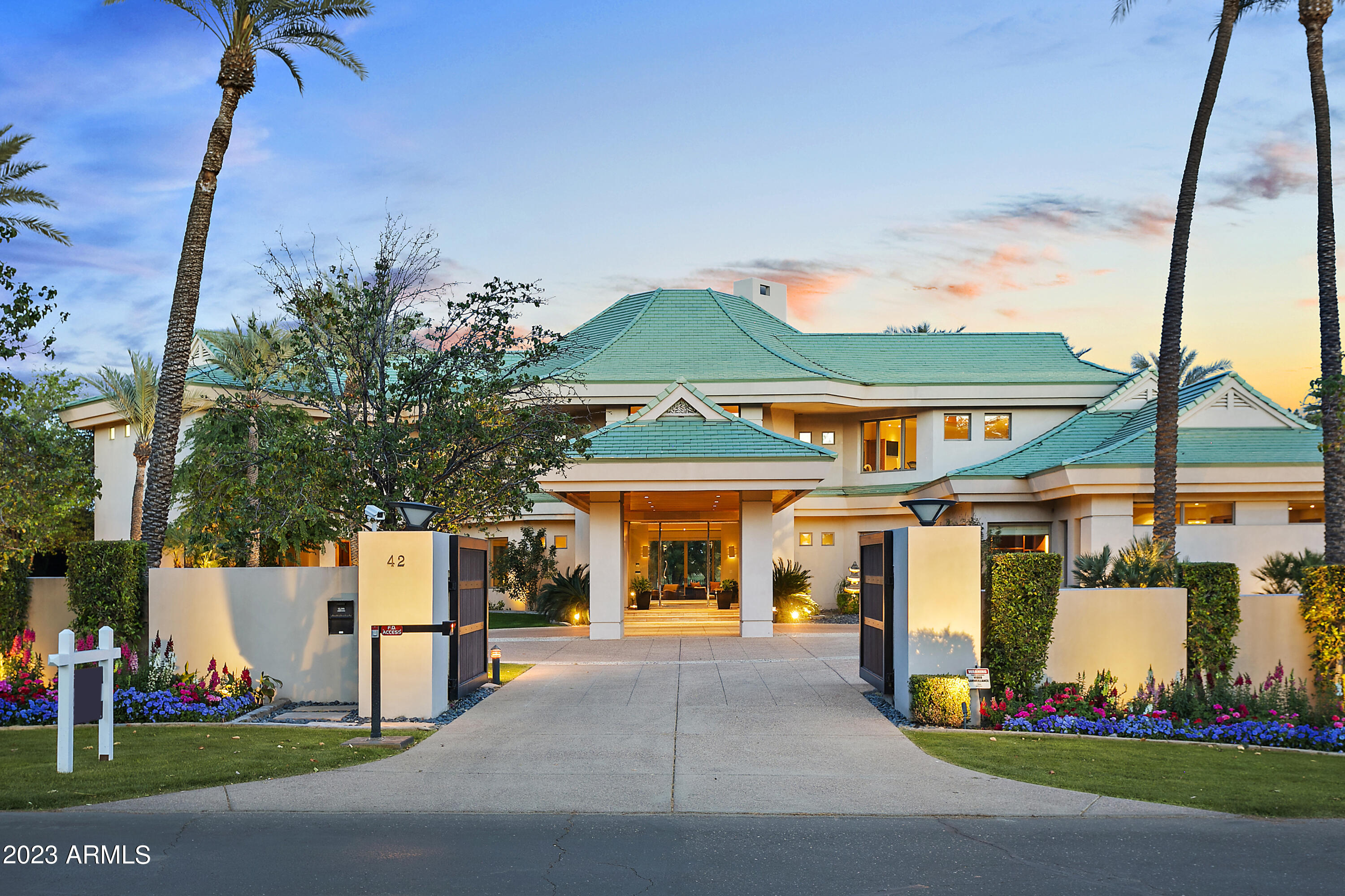 Back on the market at over $2,000,000 below the original ask price. Experience the epitome of timeless elegance & world-class sophistication. Nestled within the prestigious Arizona Biltmore resort community, this stunning estate, designed by renowned architect Bing Hu, overlooks 5 fairways with stunning views of Camelback Mountain making it one of the best lots on the ''Circle''. Boasting natural finishes & an abundance of light, this home exudes a sense of tranquility & seclusion that makes it your own private sanctuary. The sweeping owner's suite, complete with a workout room, his & hers bathrooms & closets, & a private veranda, is fit for the most discerning individuals. With grand spaces for entertaining & a chef's kitchen that exudes 5-star luxury, this home is an entertainer's dream