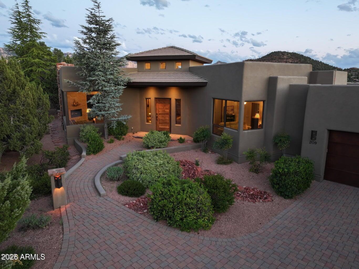 Timeless and elegant Soldiers Pass estate located in gated Casa Contenta. Exceptional quality and designer finishes throughout. Unparalleled panoramic views from nearly every room. Beautifully-located, backing to dedicated green space in a quiet cul de sac. This tranquil setting is surrounded by lush landscaping in the heart of the prestigious Soldiers Pass corridor. This sophisticated residence includes a gourmet kitchen, office/den, 3-car garage, and family room with kitchenette and guest bedrooms. This exclusive development provides pickleball, tennis, swimming pool, and spacious clubhouse. Incredible remodel in 2020.