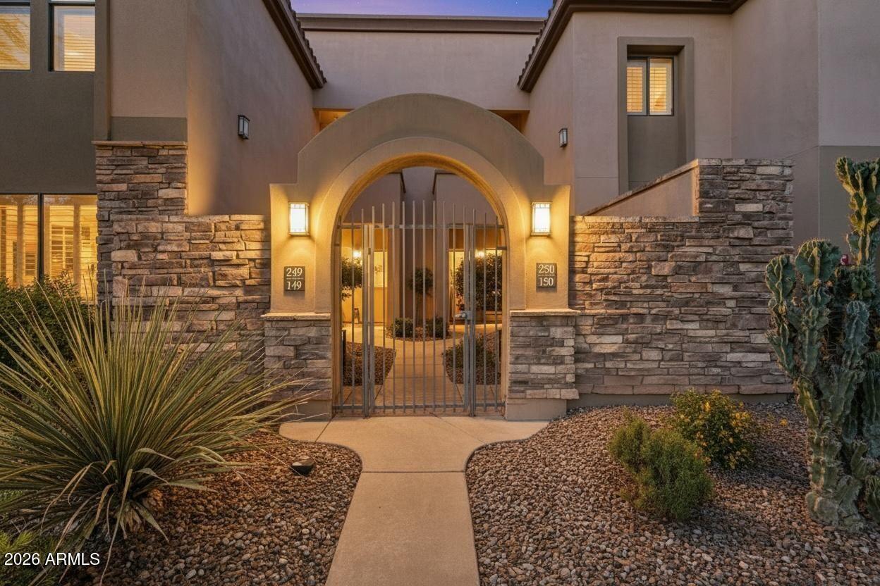 Do not miss this rarely available golf course unit with a private garage in the resort-style gated community of Traviata offering million dollar golf course and mountain views in the heart of Paradise Valley and perfectly positioned within walking distance to world-class dining, the new Ritz-Carlton, Scottsdale Fashion Square, the Scottsdale Train Park, luxury hotels and more. This open concept home features a spacious kitchen with upgraded cabinets and countertops, porcelain tile throughout main living areas, and a gas fireplace with rich granite surround. The light-filled primary suite boasts a generous walk-in closet and desk area, while recent upgrades include a new electric HVAC system (2023). Unwind with a glass of wine as the sun sets over the golf course from your private patio, host a gathering by the pool or relax in the community spa. Just bring your suitcases as this home is sold fully furnished. Whether as a primary residence, second home or investment property, this lock and leave property is ready immediately for you to start experiencing Paradise Valley living!
