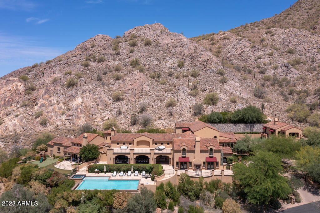 Fabulous unobstructed Mountain, City + Golf Course VIEWS from this 8 ACRE  homesite, very high in Silverleaf's, Upper Canyon! This 10,600 sqft home features 5 bedrms, 6 bathrms w/ separate complete Guest Casita, 6 car garage, full size gym, theater, large bar + walk-in wine cellar. Upon entry is a grand great rm w/ soaring exposed brick ceilings. The recently remodeled Kitchen w/ an expansive quartzite waterfall island + large butlers pantry opens to the family rm + sliding pocket doors to a fabulous oversized patio for all your entertaining needs. Master suite is located on its own private wing w/ separate his + her bathrms, spacious seating area, office, + patios creating a retreat for relaxation. Enjoy the Infinity pool, grassy childs play area, outdoor BBQ w/ bar + uninterrupted views!