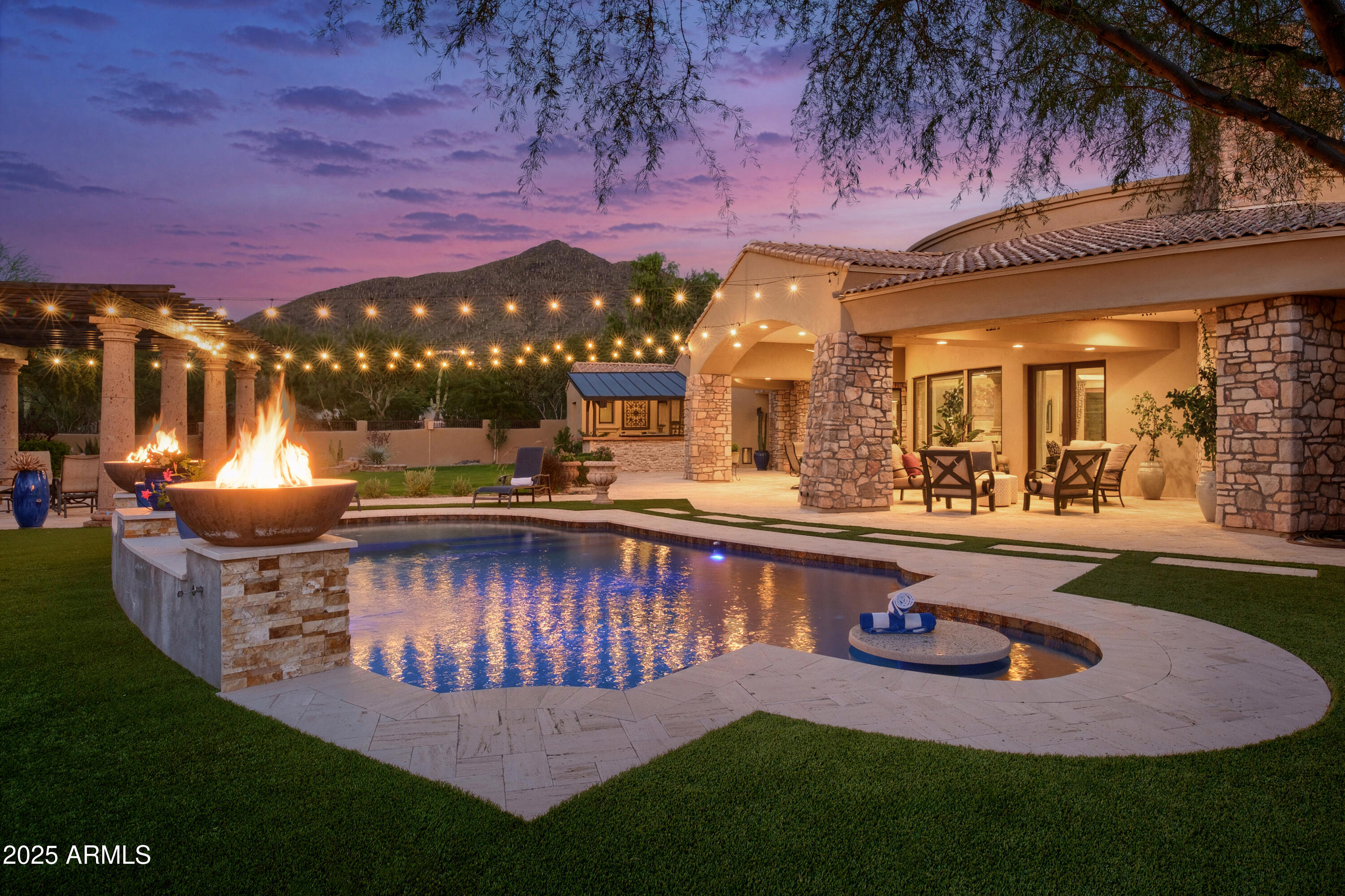 Discover the ultimate entertainer and car enthusiasts' modern custom home, set on 1.65 acres with Black Mountain and sunset views . This stunning residence showcases a desirable open-concept design w/ premium finishes completed within the last few years. The great room features expansive windows, offering full views of the backyard and flooding the space with natural light. The gourmet kitchen is open and spacious, boasting two islands and abundant counters, perfect for big parties.
Step outside to a newer backyard oasis, complete with an outdoor kitchen, pool with beach, fireplace, grass, music, perfect for all day play and lounging.
Luxurious dreamy primary bath offers his and hers walk-in closets, dual toilets, and a romantic soaking tub.
Paver-ed motor court leads to 4+ car garage Providing ample space for your prized vehicles, storage and hideaway or indulging in your favorite hobbies. With breathtaking views of Black Mountain from the spacious backyard and thoughtful details throughout, this home delivers the perfect blend of luxury, functionality, and privacy for refined lifestyle and car aficionados.