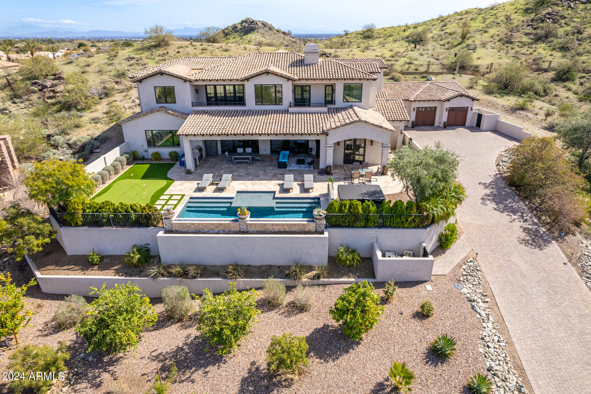 ONE OF THE MOST AMAZING CUSTOM ESTATES IN ALL OF PHOENIX*THIS AHWATUKEE DREAM ESTATE IS BUILT INTO A PRIVATE HILLSIDE OVERLOOKING THE SOUTH MOUNTAIN PRESERVE*FUNCTIONAL FLOORPLAN WITH ELEGANT & SOPHISTICATED FINISHES*ATTENTION TO DETAIL*GREAT ROOM W/FIREPLACE*FORMAL DINING ROOM*GOURMET KITCHEN WITH CUSTOM CABINETRY,DOUBLE ISLANDS, S/S WOLF GAS APPLIANCES, SUBZERO,ASKO DISHWASHERS,HOOD,MARBLE COUNTERS, & PANTRY*CUSTOM MILLWORK THROUGHOUT*4K,7.1 SURROUND SOUND THEATER ROOM WITH 12 FT SCREEN*GLASS ENCASED WINE ROOM & WINE BAR*LARGE MASTER SUITE*SPACIOUS SPA-LIKE MASTER BATH*DESIGNER WALK-IN CLOSET WITH BUILT-INS*BONUS/GAMEROOM UPSTAIRS*ALL SECONDARY BEDROOMS WITH ENSUITE BATHS*MOTORIZED DOORS*BACKYARD WITH POOL,SPA,WATER/FIRE FEATURE, & PUTTING GREEN*THIS ELEGANT & CLASSY ESTATE HAS IT ALL!!