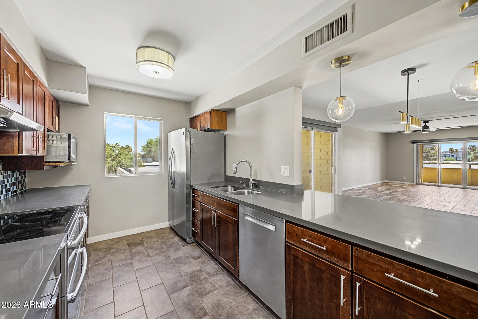 This sophisticated totally remodeled 1,374-square-foot Mid-Century Modern condo perfectly blends historic architectural charm with elevated urban living.  As a third level end unit, it is the best location in the Pierre.  Featuring 2 bedrooms and 2 bathrooms, the home boasts a bright, open-concept layout defined by classic clean lines, two spacious balconies, and iconic period details within the Pierre. Situated in a prime location, the property offers stunning, unobstructed views of the downtown Phoenix skyline, making it a rare stylish retreat in the heart of the city.