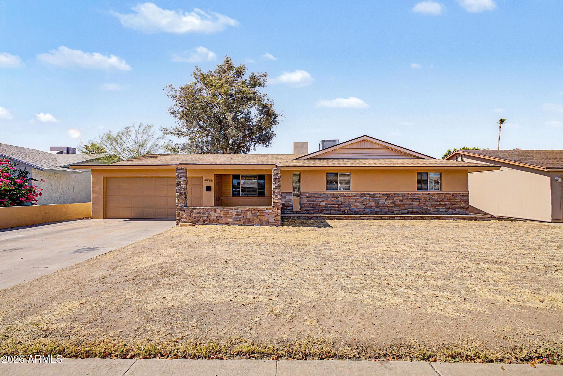 VALUE-ADD OPPORTUNITY & NO 
HOA with street views of Lookout Mountain and located within the desirable Paradise Valley School District. Open floor plan with an office nook off the family room. Large backyard backs to an alley and features an oversized covered patio and RV gate. Ideal for an investor fix-up, renovation project, or buyer looking to update the home to their own style.The seller is the original owner and knows all the history. Exterior was painted within the past 3 years. Approximate ages: A/C - 12 years, roof - 10 years, siding - 12 years.