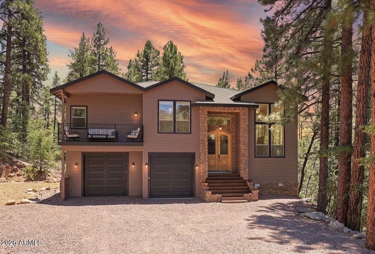 Exceptionally rare opportunity to own over 400 feet of year-round East Verde River frontage on a 3.42-acre private parcel featuring tranquil ponds and 100-year-old apple trees. This stunning custom home is perched approximately 300 feet above the river, offering breathtaking Mogollon Rim views while still allowing you to hear the soothing stream from the home with windows open. The home features 4 bedrooms, a theater room, living room, and great room, highlighted by exquisite granite countertops, a wood-burning stone fireplace, and laminate wood flooring throughout. The primary suite offers its own private deck with breathtaking Rim views, while the primary bath includes a jetted tub, walk-in shower, and spacious walk-in closet. An additional deck off the great room provides the perfect space to relax and enjoy the serene surroundings. The entire exterior of the house was repainted in February 2026. 

The lower portion of the property fronts the East Verde River and includes a barn, offering serene water views and seasonal fishing opportunities. Ideal for horses, riding quads directly from your doorstep, or simply enjoying the natural beauty. Towering Ponderosa pines surround this magical, private setting.

Conveniently located just 25 minutes from Payson for shopping and dining, and 45 minutes to the lake for boating and fishing.

The lower portion of the lot lies partially within a flood plain. County assessor lists the home at 2,445 sq. ft.; previous owners were informed by a builder that the home measures approximately 2,701 sq. ft. Buyer and Buyer's Agent to verify all facts and figures deemed important. Information deemed reliable but not guaranteed.

Make memories here as this one-of-a-kind riverfront retreat won't last.

*Some exterior photos were taken in prior seasons/years to illustrate the property's seasonal landscaping and foliage.