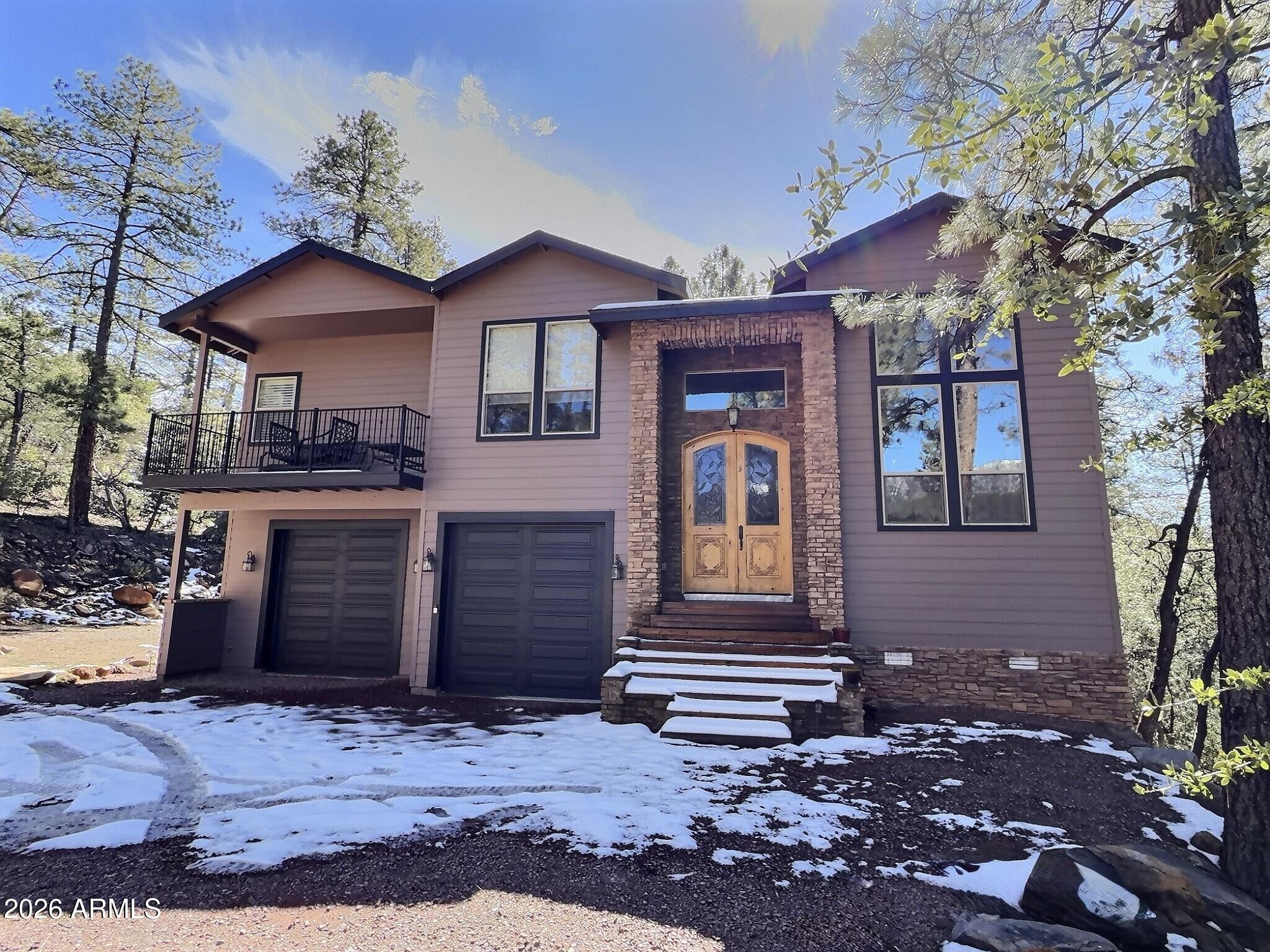 Exceptionally rare opportunity to own over 400 feet of year-round East Verde River frontage on a 3.42-acre private parcel featuring tranquil ponds and 100-year-old apple trees. This stunning custom home is perched approximately 300 feet above the river, offering breathtaking Mogollon Rim views while still allowing you to hear the soothing stream from the home with windows open. The home features 4 bedrooms, a theater room, living room, and great room, highlighted by exquisite granite countertops, a wood-burning stone fireplace, and laminate wood flooring throughout. The primary suite offers its own private deck with breathtaking Rim views, while the primary bath includes a jetted tub, walk-in shower, and spacious walk-in closet. An additional deck off the great room provides the perfect space to relax and enjoy the serene surroundings. The entire exterior of the house was repainted in February 2026. 

The lower portion of the property fronts the East Verde River and includes a barn, offering serene water views and seasonal fishing opportunities. Ideal for horses, riding quads directly from your doorstep, or simply enjoying the natural beauty. Towering Ponderosa pines surround this magical, private setting.

Conveniently located just 25 minutes from Payson for shopping and dining, and 45 minutes to the lake for boating and fishing.

The lower portion of the lot lies partially within a flood plain. County assessor lists the home at 2,445 sq. ft.; previous owners were informed by a builder that the home measures approximately 2,701 sq. ft. Buyer and Buyer's Agent to verify all facts and figures deemed important. Information deemed reliable but not guaranteed.

Make memories here as this one-of-a-kind riverfront retreat won't last.

*Some exterior photos were taken in prior seasons/years to illustrate the property's seasonal landscaping and foliage.