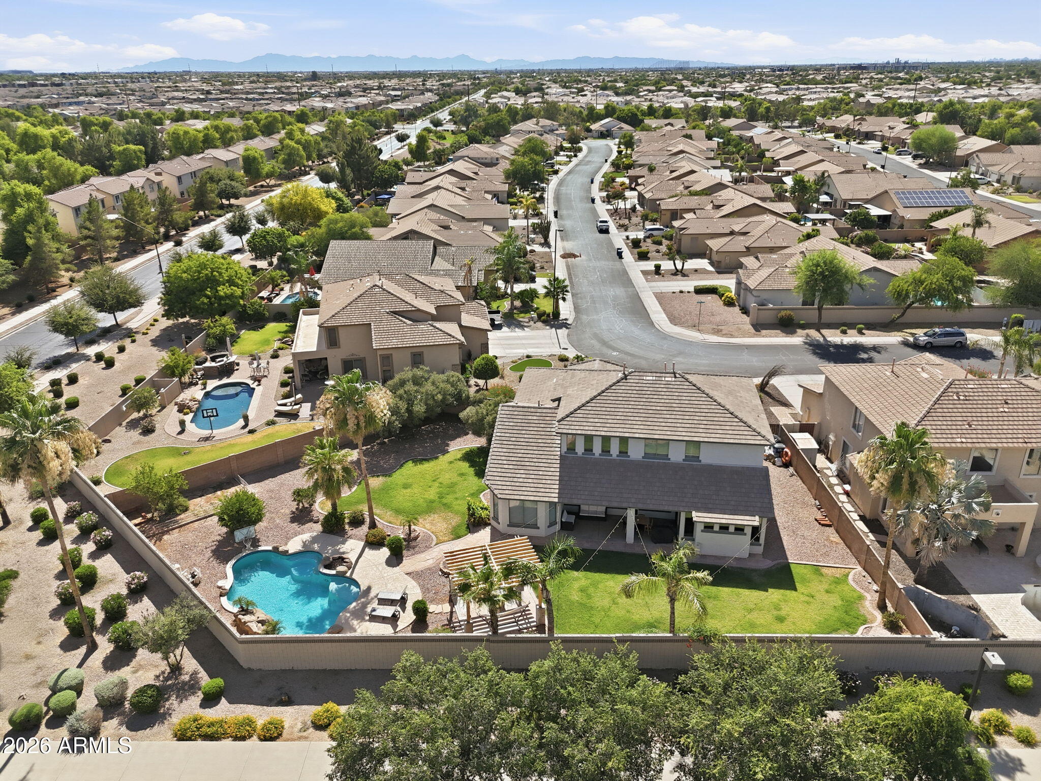 Situated on one of the largest lots in the neighborhood, this home offers exceptional privacy w/ no neighbors behind. Meticulously maintained throughout, the home welcomes you w/ soaring ceilings, abundant natural light, & upgrades throughout.  The beautifully appointed kitchen features SS appliances, granite counters, travertine backsplash, custom cabinets, spacious island, & walk-in pantry. The spacious primary suite is conveniently located on the main level and serves as a private retreat. Additional Bedroom/Office/Nursery located on main level. The upstairs features 3 large bedrooms & loft space. The backyard is designed for entertaining. Large grassy areas for kids/pets, newly installed gazebo for entertaining, & pool was recently updated w/ new pebble tec surface & travertine coping.