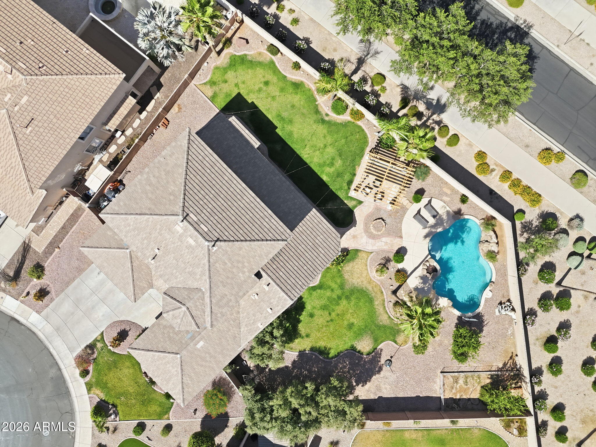 Situated on one of the largest lots in the neighborhood, this home offers exceptional privacy w/ no neighbors behind. Meticulously maintained throughout, the home welcomes you w/ soaring ceilings, abundant natural light, & upgrades throughout.  The beautifully appointed kitchen features SS appliances, granite counters, travertine backsplash, custom cabinets, spacious island, & walk-in pantry. The spacious primary suite is conveniently located on the main level and serves as a private retreat. Additional Bedroom/Office/Nursery located on main level. The upstairs features 3 large bedrooms & loft space. The backyard is designed for entertaining. Large grassy areas for kids/pets, newly installed gazebo for entertaining, & pool was recently updated w/ new pebble tec surface & travertine coping.
