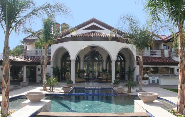 Appraised Oct'06 at $8.3M.Price reduced over $1,325,000!Your buyer is in the right place at the right time.Gated estate on the Adobe golf crse w/views of golf greenery & mtns,the epitome of luxury.Year-long renovation finished in `06 makes home look brand new.Private circle drive leads you past ponds/waterfalls to a grand porte cochere.In true European style the rooms are of grand scale w/high ceilings & massive fireplaces.Kit & master are opulent w/every amenity.All bdrms are ensuite w/kids,young & old,playrms & computer rms nearby.Bkyd has more invested than the cost of most entire homes,some resorts do not look as good.You will not find so much for this price anywhere!