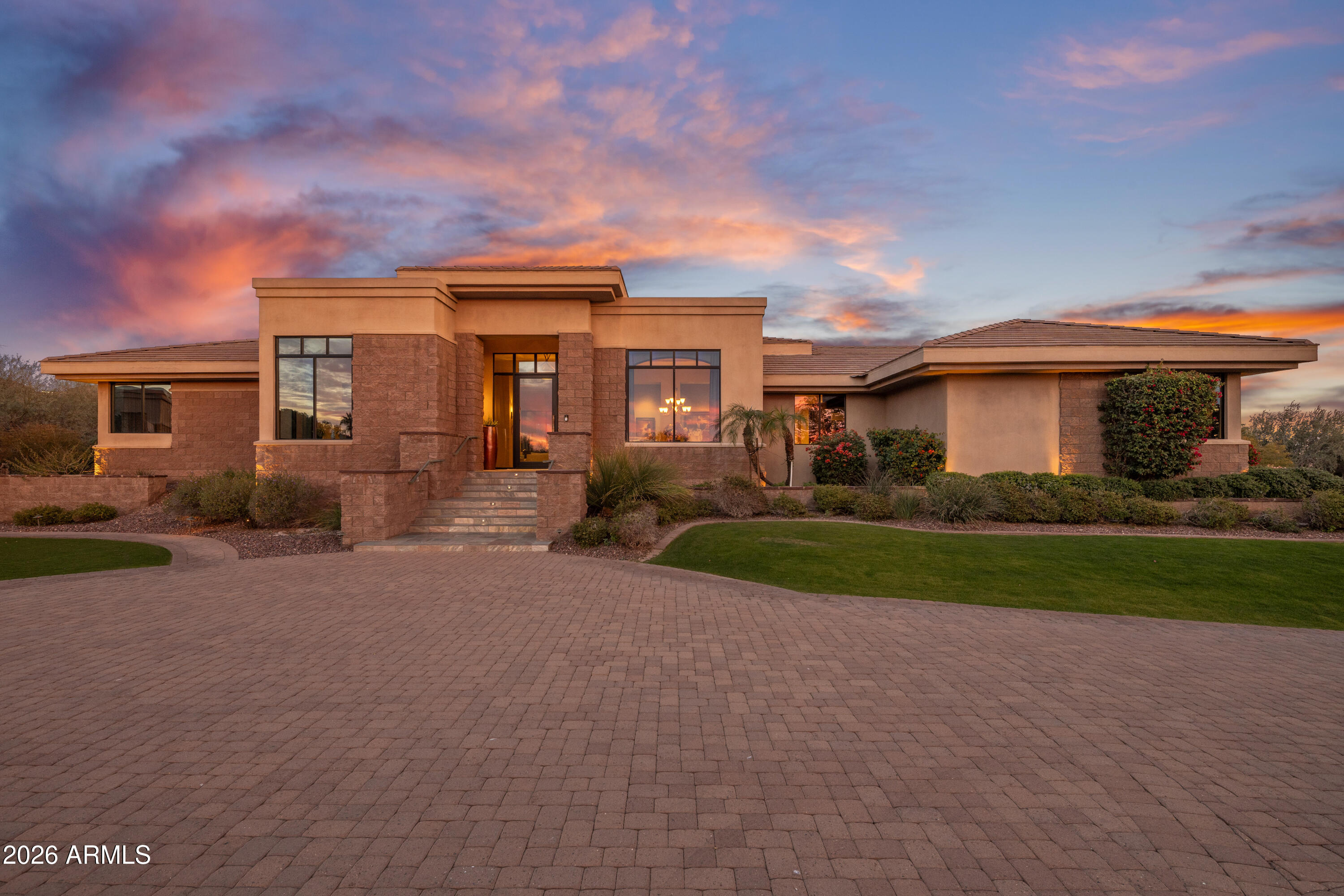 AN ELEVATED PRIVATE ESTATE on 1.48 acres located in one of Paradise Valley's most prestigious residential pockets. 360 degree sweeping views from Camelback to city lights. MOVE IN READY. The 5050 sf main residence offers 4 en-suite bedrooms and a flex office/5th bedroom. The entertainers kitchen includes a Viking and Dacor appliance suite. Indoor/outdoor living shines with a grand covered travertine patio, outdoor kitchen, heated pool, spa, shower, rooftop entertainment deck, and space for a sport court or casita. AUTO ENTHUSIASTS will love having 2 separate garage locations: an attached 3-car and a large detached 3+ car garage w/lift and TV lounge. A Crestron smart home built with exceptional quality and intention. Thoughtfully conceived, meticulously built, and deeply cherished by its current owners, this residence offers exceptional structural integrity, a highly functional floor plan, and an irreplaceable setting. The location and views are truly one of a kind--elements that cannot be replicated--while the opportunity to refine and personalize the interiors remains entirely within reach.
The home has been lovingly cared for and has custom, high quality finishes that have years of fine life left in them. 
Some respected Paradise Valley/Scottsdale luxury custom home builders have toured the property and shared that constructing a residence of comparable caliber on this lot today would likely exceed $9 million and require well over a year to complete. This presents a rare opportunity to acquire a home of enduring substance and, if desired, reimagine it with your own bespoke vision--resulting in a distinctive estate that stands apart from the uniformity of today's new builds.
This is a property that discerning buyers will recognize as truly exceptional--one that others will wish they had aquired.

Buyers are advised to independently verify all details of personal importance.