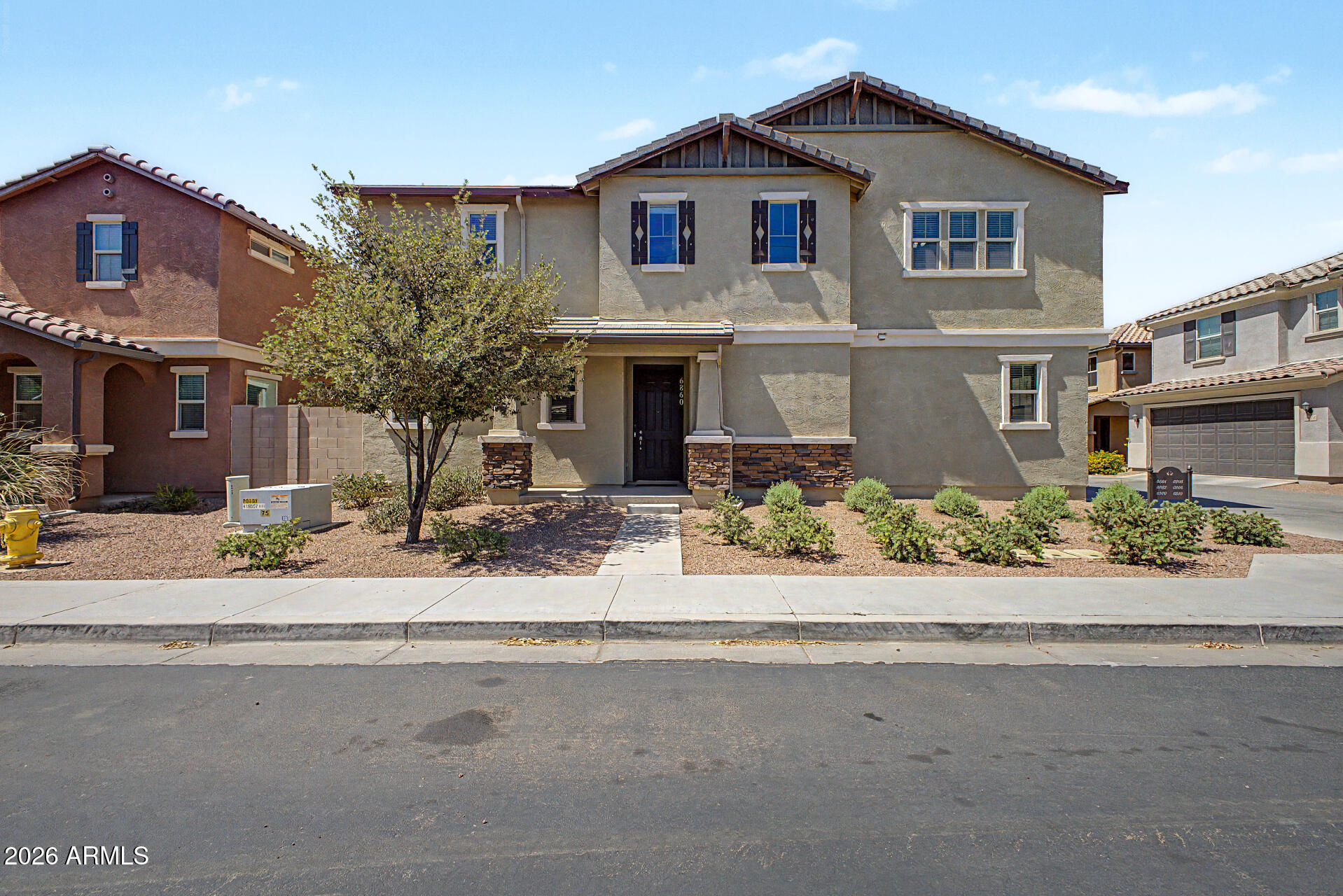 Welcome to Dahlia Pointe. Beautiful 4bed 3 full bath home in desirable Dahlia Point! Enjoy family-friendly  Community amenities include a pool and playground, while nearby ASU Polytechnic, Phoenix-Mesa Gateway Airport, SanTan Village, and easy freeway access to the 60 and 202 This open-concept floor plan features 9-ft ceilings, tile flooring in main living areas, and a stunning kitchen with granite countertops, large island, ENERGY STAR® certified  The split-bedroom layout offers a private primary retreat with a spacious walk-in shower. Relax outdoors on the extended covered patio overlooking the landscaped backyard with automatic watering system. Convenient Mesa location near schools, shopping, dining, and freeway access.