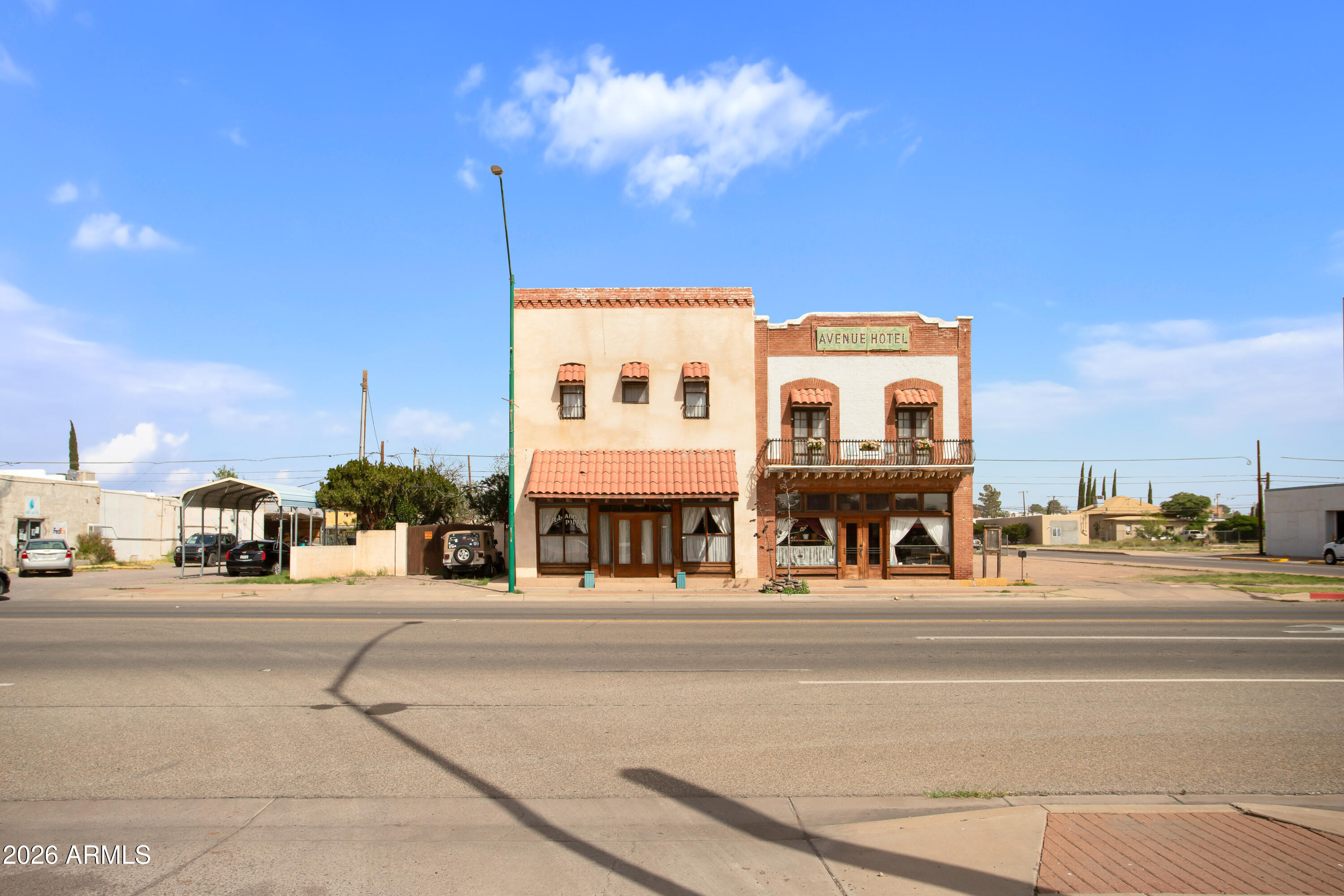 Step into a rare investment opportunity with this historic hotel in the heart of Douglas, rich in character and timeless charm. Originally built in 1901 and expanded in 1915, this iconic property offers a unique blend of history, functionality, and income potential.

The hotel features 25 guest rooms along with a welcoming lobby, a fully equipped commercial kitchen, on-site restaurant and bar, and even a classic barbershop--creating a true destination experience. Additional amenities include coin-operated laundry facilities and an inviting outdoor kitchen and entertainment area, perfect for hosting guests and events.

Offered furnished and equipped with the essential items for daily operations, this turnkey property is ready for its next chapter. Whether you're looking to restore historic landmark, expand a hospitality portfolio, or create a boutique experience, this one-of-a-kind property delivers unmatched potential in a prime location. *Paintings, Decor, Knick-Knacks and Taxidermy animals do not convey*
