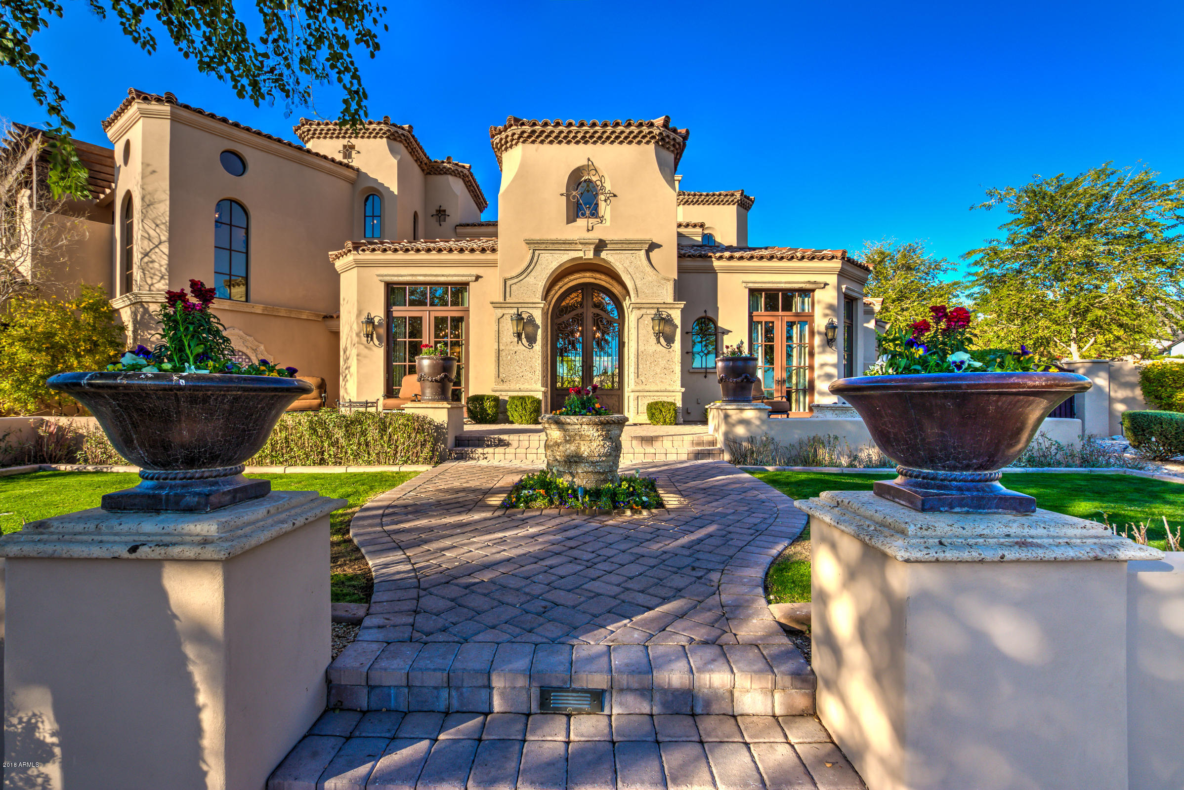 Nestled in the heart of Scottsdale's prominent neighborhood, Arcadia-Silverleaf, lies this stunning 6 bedroom/5 bathroom estate with separate guest house with its own full kitchen, living room & 2 bedrooms on .61 acres! With breathtaking scenery of the mountains & city views, this custom masterpiece is extraordinarily elegant and offers the ultimate wow factor throughout every aspect of the home. Expansive floor plan, totaling at 6559 livable square feet, includes a state of the art pool, luxurious guest casita, and exquisite amenities to provide a sophisticated resort-feel to this magnificent home. This ultimate Candelaria Design/Fratantoni Luxury Estates built home will certainly impress.