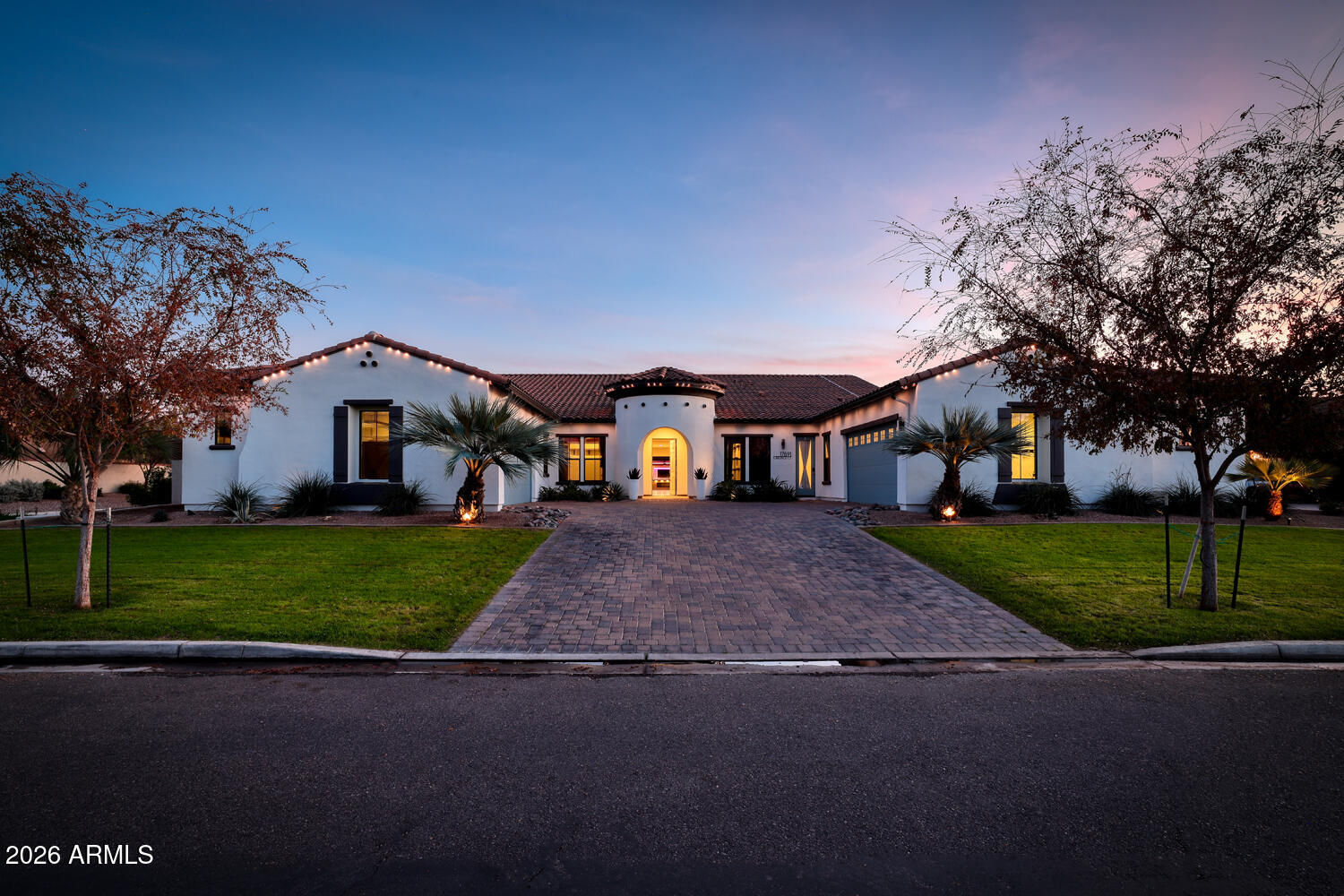 ENERGY SAVINGS - TESLA SOLAR with Back up batter. Absolutely stunning and thoughtfully designed, this exceptional Toll Brothers luxury residence is located in the prestigious gated community of Dorada Estates. Offering 5,720 square feet of elegant living space, the home features 5 bedrooms, 4.5 bathrooms, a den, media-bonus room, private office, and a four-car garage--perfectly balancing comfort, style, and functionality. From the moment you enter, you are welcomed by soaring 10-foot ceilings and a bright, open floor plan ideal for both everyday living and entertaining. The chef's kitchen is truly a centerpiece, showcasing two dishwashers, dual expansive 12-foot granite islands, a built-in refrigerator, five-burner gas range, and a butler's pantry--designed to impress and inspire. The Kitchen looks over into the expansive great room so that you can be part of the entertainment. Just off the main living areas, the media/bonus room offers a flexible and inviting space ideal for movie nights, gaming, or hosting sporting events. Whether used as a home theater, lounge, or secondary family room, this versatile space provides endless possibilities for relaxation and entertainment.
The luxurious primary suite is a private retreat, featuring a spa-like en-suite bath with a soaking tub, oversized glass-enclosed shower, dual vanities, and an expansive walk-in closet complete with its own dedicated laundry. Each additional bedroom offers an en-suite bath, providing comfort and privacy for family and guests alike.
Seamless indoor-outdoor living is achieved through a dramatic 15-foot pocket door that opens to your resort-style backyard oasis. Enjoy a heated pool and spa, outdoor shower, pergola, and a newly added outdoor kitchen with BBQ and cozy fire features (installed December 2022). The space is beautifully complemented by a grassy play area and lush citrus trees perfect for relaxing or entertaining year-round.
Situated on an oversized 20,800 sq. ft. north/south-facing corner lot, the property also includes a second laundry room, RV gate, dog run, and an extended two-car garage bay with built-in cabinetry. 
Additional thoughtful upgrades enhance accessibility and comfort, including wider hallways, oversized solid-core doors, two zero-entry showers, and convenient access to the main entry, covered patio, and recreational areas.
Located within the highly rated Chandler Unified School District, this move-in-ready home offers the rare opportunity to enjoy luxury living with all upgrades already completed.