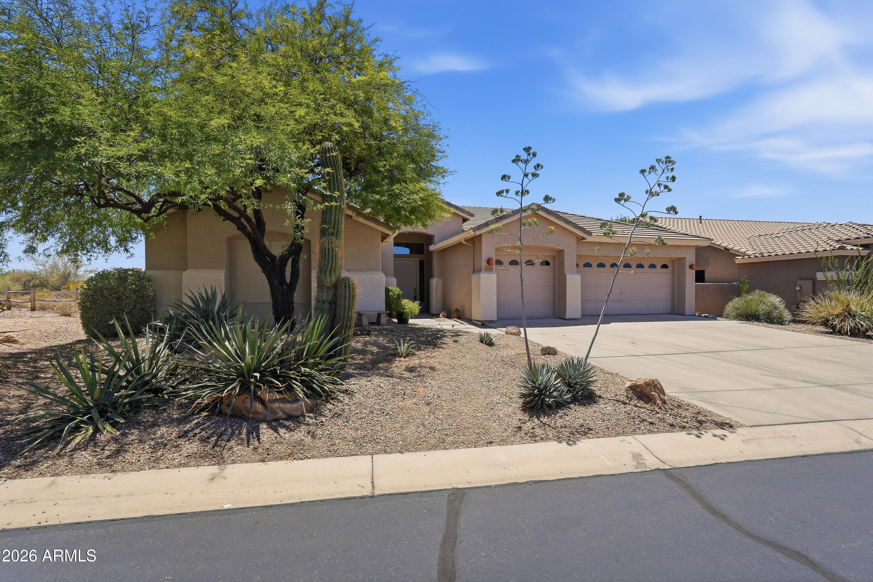 Private end-lot on a ''no outlet'' cul-de-sac with desert views & no neighbors on one side! Soaring ceilings & terrific split floor plan offers extra privacy, with a primary suite on one side and a second ensuite bed/bath on the other side that's perfect as a guest room. Three whole bedrooms and 3 full baths PLUS a den/office (convertible to 4th bedroom). Master suite features double sinks, soaking tub, separate shower, and large walk-in closet. Spacious eat-in kitchen w/ island overlooks generous family room featuring gas fireplace. Backyard with pool, cozy beehive fireplace, built-in BBQ, and elevated deck play pool. View fencing allows for expansive natural desert views with no neighbors behind or to one side. Great opportunity to buy in this desirable gated community of Colina del Nort Located just minutes to top-notch shopping, hiking, dining and golf. And only 5 minutes to the quaint towns of Cave Creek and Carefree! Wow!