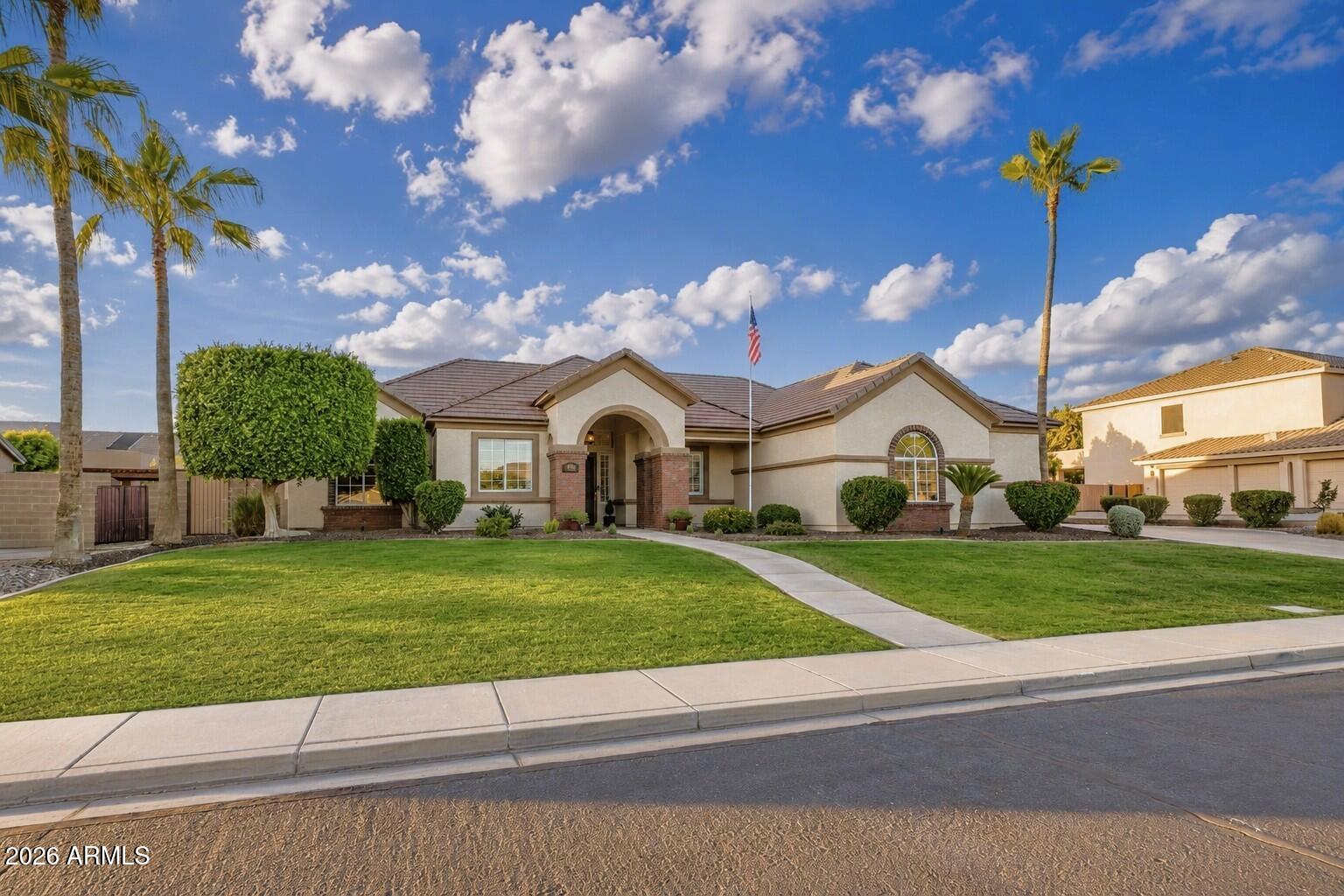 Rare HOA-Permitted RV Parking, a generous 1,100 SF Garage, and an Entertainer's Backyard Oasis on a 15,000+ SF Lot! Welcome to your Northeast Mesa dream home--this immaculate 2,517 SF single-level residence perfectly captures the Arizona lifestyle with an oversized north-facing covered patio, a private putting green, and lush natural grass. Offering ultimate peace of mind with a brand-new 2026 roof underlayment, the property boasts incredible curb appeal outside and mutliple upgrades inside, including plantation shutters throughout, custom built-ins, and a tailored primary suite. A thoughtfully curated interior palette creates a seamless flow, artfully balancing crisp pale cream walls with rich accents of desert modern colors that work effortlessly. It begins with an inviting entry leading into the heart of the home: an expansive great room featuring a tray ceiling and low-maintenance LVP flooring. Nearby, a versatile bonus room serves as the perfect formal dining room, play area, or entertaining space, complete with newer custom cabinetry and distinctive quartz countertops. The chef's kitchen is a true standout, boasting full-overlay maple cabinets, granite countertops, a Bosch counter-depth refrigerator, a 5-burner gas range, a walk-in pantry, reverse osmosis filtration, and an extra-deep sink that opens to a light-filled breakfast nook.

Working from home is a dream in the fully redesigned den, stunningly appointed by Classy Closets with bespoke soft-close cabinetry, drawers, file cabinets, open shelving, soft white quartz countertops, and integrated connectivity access. Retreat to the primary suite sanctuary, featuring a fully customized walk-in closet designed and built by Closet Masters, complete with seeded glass partitions and a built-in fire-resistant safe. The renovated, spa-like primary bath offers dual vanities, quartz countertops, a floor-to-ceiling tiled walk-in shower, and a relaxing Jacuzzi garden tub. Two additional guest bedrooms offer maximum comfort with plush carpeting and expansive closet space, while the well-appointed guest bathroom features a tiled shower surround, granite counters, and extended vanity space. An oversized laundry room provides additional storage with more built-in cabinetry and an extra-deep sink.

Hobbyists will marvel at the rare, oversized 1,100 SF garage, finished with gleaming epoxy floors, built-in cabinets, LED lighting, and a suspended storage rack. The third-car bay is an impressive 27' deep, and an over-height garage door allows plenty of room for high-clearance vehicles. A roomy side yard features double RV gates and a concrete pad, providing extra space for parking and toys--and a newer hot water heater provides added peace of mind. Best of all, RV and boat parking is fully permitted here, a rare find within an HOA!

Alta Mira Estates is located in the highly desirable Northeast Mesa area, just minutes from the Loop 202 with easy access to airports, Scottsdale, Phoenix, and Tempe. This prime location is in close proximity to the Salt River and several lakes, as well as premier hiking, mountain biking, road biking, golf, paddling, kayaking, and fishing--plus, it's a mere one-hour drive to the cool pines of Payson! The community park features basketball and pickleball courts, a children's playground, a covered ramada, and a grassy play space.