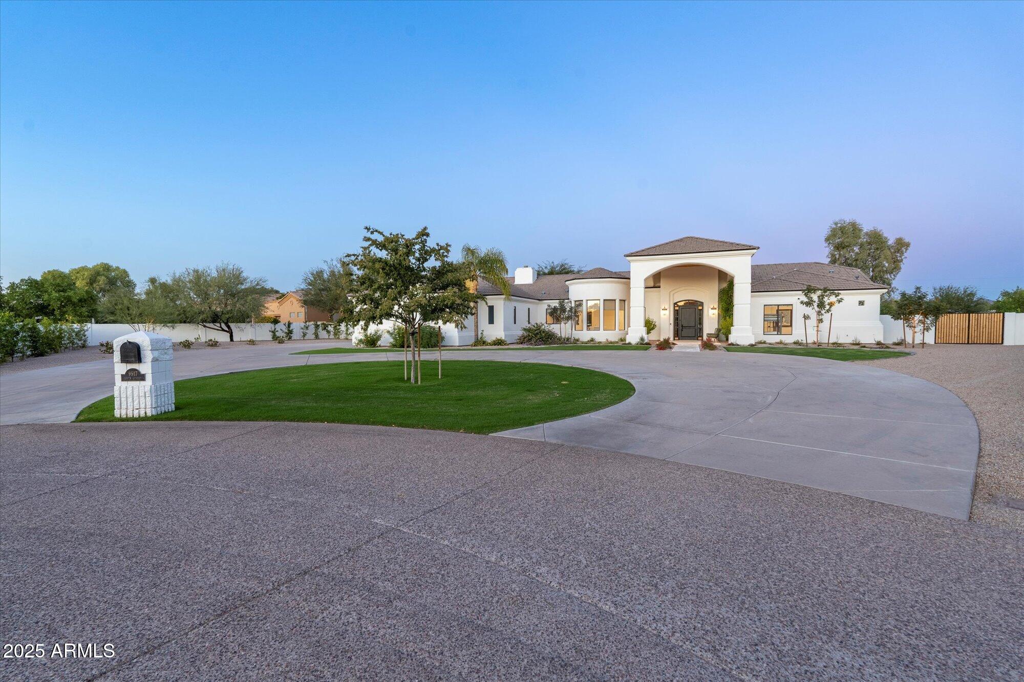 Completely, right to the studs, reimagined in 2022 to create transitional elegance to the nines and can be sold furnished. Family Style Residence yet chic; on a quiet Cul-De-Sac, 1.2 acre pie-shaped lot, views of the McDowell Mountains; NO HOA! All on one level living; featuring a gorgeous ''out of a magazine'' look, with high end quality cabinetry, tiles and fixtures throughout. Top of the line appliances, stylish wide plank wood flooring, wide baseboards, 5 bedrooms, 4.5 bathrooms, partially light and bright guest quarters on the lower level, room for a sport court, pickleball, tennis, BBQ - Guest Home or RV Garages. Expansive motor court leads into a fantastic Garage setup for car lovers who value space, natural light and ease of access.  Don't miss this home....