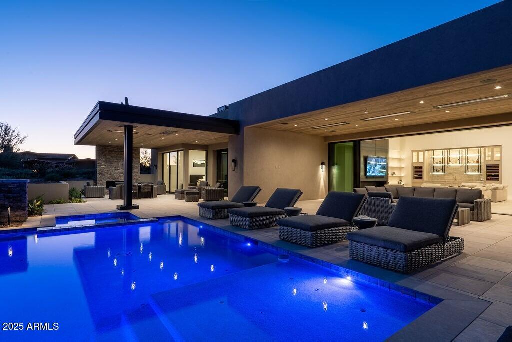 GOLF Membership available - New build in Desert Mountain's Village of Gambel Quail Preserve Lot 215 now complete!. Spectacular combination of Black Stone Development and Graffin Design on this cutting edge contemporary home featuring everything that today's buyers are seeking! Home features 4 bedrooms, office oversized laundry room and four car garage. Ideal great room floor plan. Oversized master bedroom with spa like bath and dual closets. A chef's kitchen with all the latest in high end appliances and cutting edge finishes that spill out to the patio through walls of glass, multi slide door systems and into the outdoor living, dining, patio, pool/spa and outdoor kitchen for today's outdoor living needs. Enjoy ample storage for autos and outdoor adventures in the four car garage with additional storage closet. Views include surrounding mountains including Lone Mountain, Black Mountain, The Continentals, sunsets and Desert Mountain night lights. The location of Gambel Quail Preserve is close to the main gate for quick access to shopping and dining. Additional community amenities include golf, biking and hiking trails. The Sonoran Fitness Center (spa, pickle ball, tennis, swimming, fitness facilities and much more) is nearby.