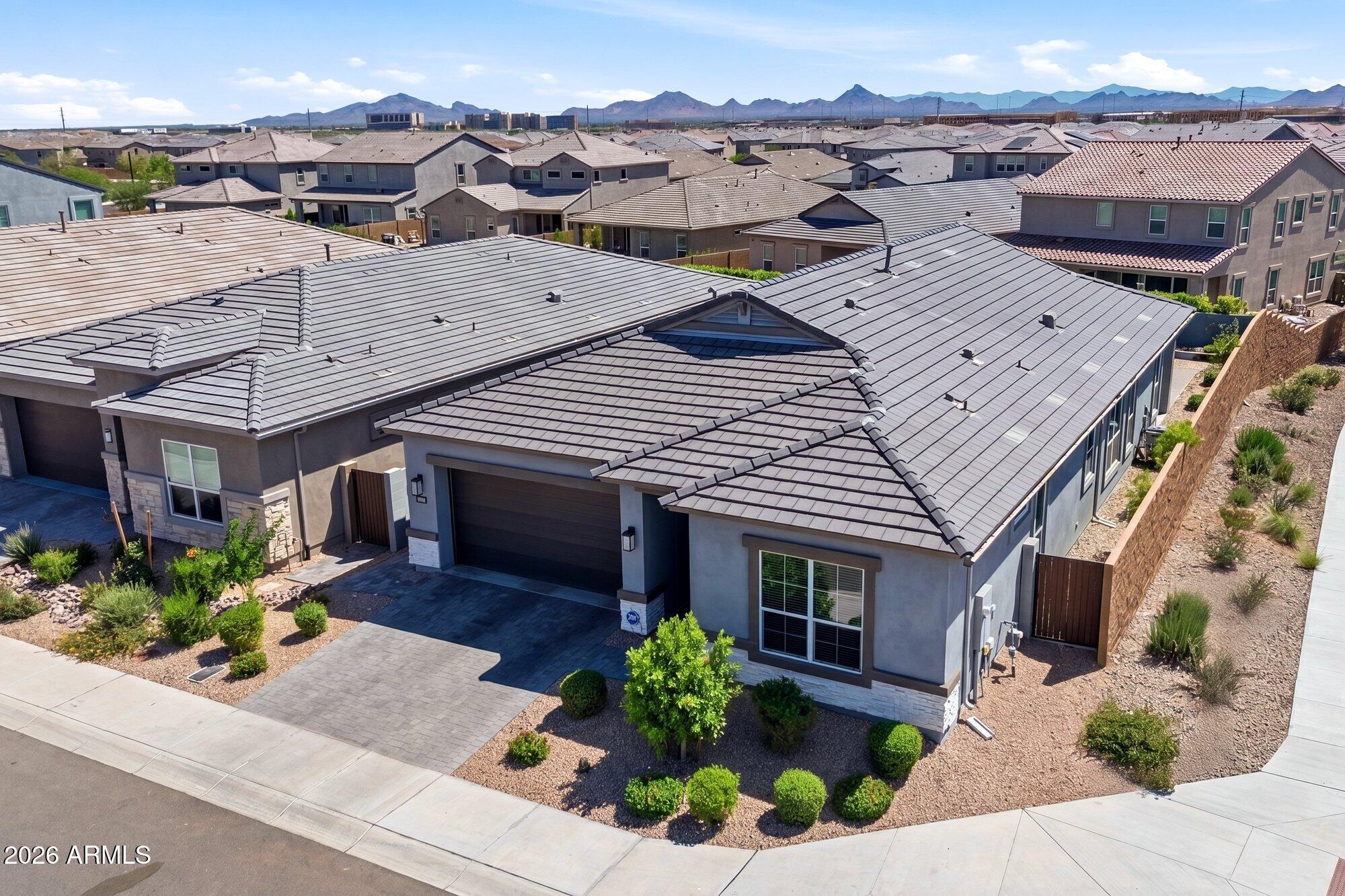 Experience refined desert living in this newly 2024 built home on a desirable corner lot in Talinn at Desert Ridge. This exceptional residence showcases a bright, open-concept layout with upscale finishes, high ceilings, spacious gathering areas, and seamless flow throughout. The thoughtfully designed floor plan offers 3 bedrooms, 2.5 baths, a 3-car garage, and low maintenance backyard creating the perfect balance of style and functionality.  Nestled in one of North Phoenix's most desirable locations, residents enjoy easy access to premier shopping, dining, entertainment, golf, and outdoor recreation. Combining modern luxury, convenience, and lock-and-leave ease, this home presents an outstanding opportunity to enjoy the vibrant Desert Ridge lifestyle.
