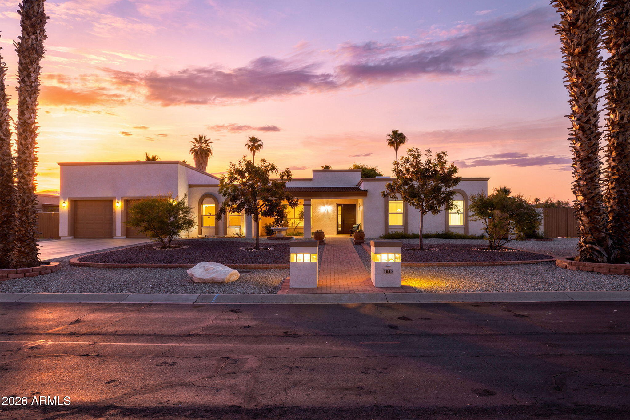 Price improvement just in time for you to make this your summer retreat! This block construction home is open, welcoming, and beautifully updated! This home offers the space, comfort, and functionality buyers are looking for. From the remodeled chef's kitchen to the expansive backyard pool retreat, every detail invites you to settle in and enjoy Arizona living. There is plenty of room in the back to add a guest house or extend the primary suite or just enjoy. This home stands out with its rare oversized garage with 12-foot height, rear access, and RV gate. This home is located on a quiet interior street of Hidden Manor where pride of home is evident! You must see this wonderful home offering 2,502 square feet of thoughtfully updated living space on an expansive 18,000-square-foot lot... The open and welcoming feel is noticeable the moment you walk through the door. Beautiful tile flooring flows throughout the main living areas while carpet adds comfort in the bedrooms. The remodeled kitchen is a true centerpiece, designed to showcase gorgeous granite countertops, a spacious kitchen island, GE Monogram appliances to include double ovens, and a built-in refrigerator.  A spectacular kitchen any chef will appreciate. The home features four bedrooms and two and a half bathrooms, along with a spacious great room anchored by a charming fireplace, perfect for those cool desert winter evenings. Step outside and enjoy an impressive backyard designed for Arizona living, complete with a large pool ready for summertime fun and a generous covered patio that provides shade for outdoor dining, relaxing, and entertaining. The garage offers over 900 sq. ft. of space with two front garage doors and a rear access door, current car lift, and abundant overhead storage make this a car lovers dream! With all this garage space you have even more flexibility for vehicles, toys, tools, or hobbies. Located near Arrowhead Mall and Costco, dining, shopping, and entertainment! This beautifully updated Glendale home offers space, lifestyle, and rare garage functionality all in one! A new water heater was installed in May 2026 for greater peace of mind and a 1 year comprehensive home warranty will convey with the home!