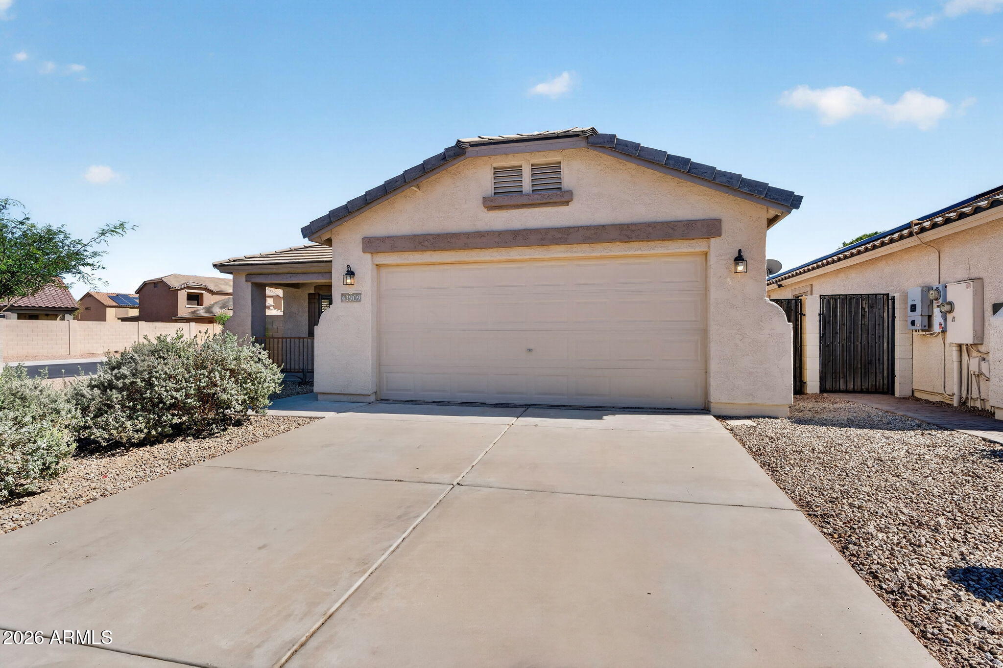 Beautifully remodeled single-level home on a desirable corner lot in the Senita community of Maricopa. This 3-bedroom, 2-bath home has been freshly updated with new wood-look flooring, new baseboards, fresh interior paint, brand-new stainless steel appliances, and resurfaced countertops, giving the home a clean, modern, move-in ready feel. The open living area offers plenty of natural light and flows easily into the kitchen and dining space, creating a comfortable layout for everyday living. The kitchen features generous cabinet storage, refreshed counters, stainless steel appliances, and a breakfast bar overlooking the main living area. The primary suite includes a private bath with dual sinks, while the secondary bedrooms offer flexibility for guests, office space, or hobbies. Outside, the low-maintenance backyard provides a blank canvas with plenty of room to design the outdoor space you want, all while keeping upkeep simple. Located in Senita with nearby parks, playgrounds, basketball courts, shopping, dining, and convenient access to major routes, this freshly remodeled home is ready for its next owner.